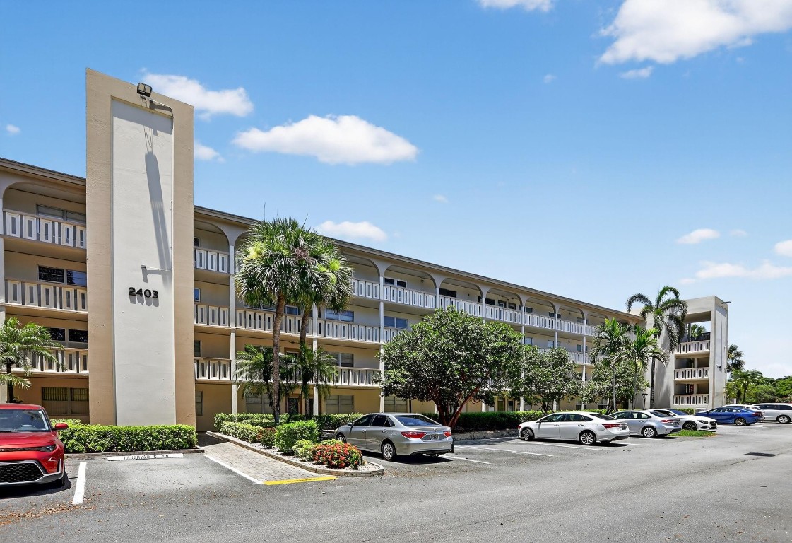 This charming and move-in ready condo features 2 spacious bedrooms and 2 modern bathrooms, with tile flooring in the kitchen and bathrooms and rich hardwood floors throughout the rest of the home. The updated kitchen offers real wood cabinets with lots of storage, while both bathrooms have been tastefully renovated for comfort and style.Enjoy peace of mind with hurricane impact windows and doors, and relax with serene garden views from your inclosed balcony. Located near the community gate, this unit offers quick and easy access in and out — ideal for your daily convenience. A perfect blend of style, comfort, and location! This charming and move-in ready condo features 2 spacious bedrooms and 2 modern bathrooms, with tile flooring in the kitchen and bathrooms and rich hardwood floors throughout the rest of the home. The updated kitchen offers real wood cabinets with lots of storage, while both bathrooms have been tastefully renovated for comfort and style.Enjoy peace of mind with hurricane impact windows and doors, and relax with serene garden views from your inclosed balcony. Located near the community gate, this unit offers quick and easy access in and out — ideal for your daily convenience. A perfect blend of style, comfort, and location!