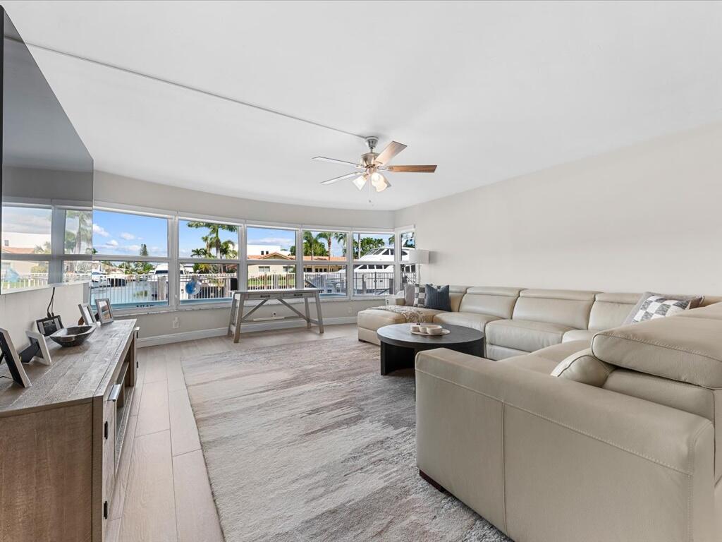 MOTIVATED SELLER!! NOW OFFERED FURNISHED!!   Discover the finest in coastal living in Fort Lauderdale. This fully remodeled, ground-floor residence showcases a desirable split floor plan with 2 bedrooms and 2 bathrooms, positioned directly on the canal to offer serene, picturesque water views--perfect for both beach lovers and boating enthusiasts.  The modern kitchen is appointed with white shaker cabinetry, stainless steel LG appliances, and elegant marble countertops. An open-concept layout invites natural light and water views into the kitchen, dining, and living areas, as well as the primary bedroom. Additional enhancements include an in-unit ventless LG washer/dryer combo, a new water heater, and a new Bosch HVAC system. Boaters will value the effortless canal access, while the community provides exceptional amenities such as a heated pool, BBQ patio, tiki hut, and dog park. Ideally located, the residence is just a 10-minute walk to the beaches of Lauderdale-by-the-Sea and a short drive to the renowned Pompano Beach Pier and the Fort Lauderdale beachfront promenade, featuring an array of restaurants, shops, and vibrant nightlife.  The property allows annual rentals immediately after closing. All certifications and SIRS have been completed, and all assessments are fully paid, offering a seamless and stress-free ownership experience.