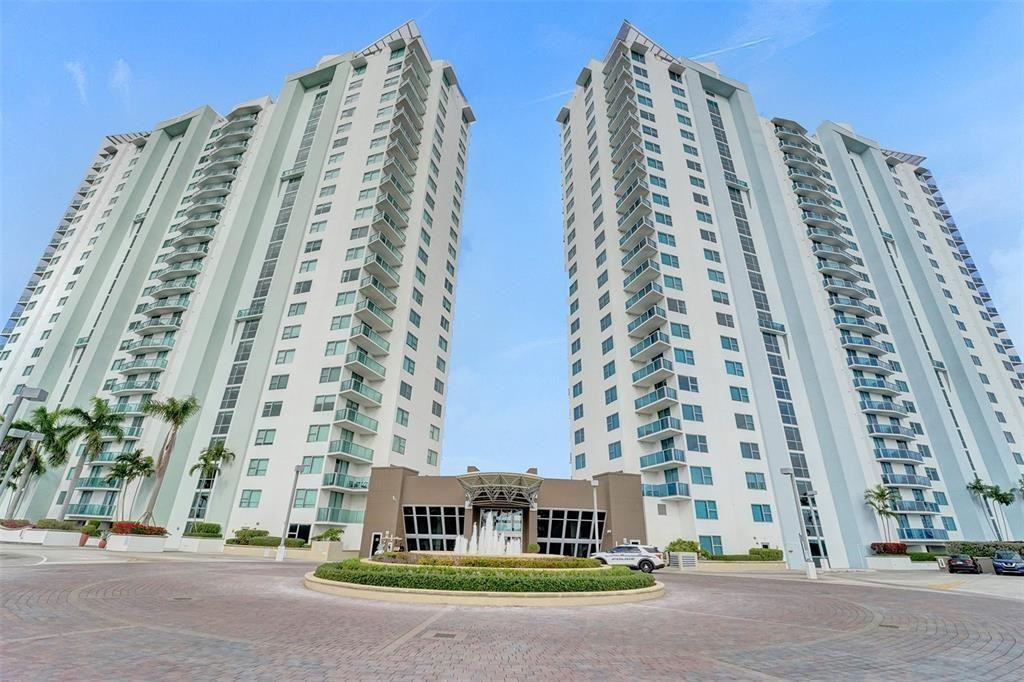 Two-bedroom, two-bathroom unit at Tao Sawgrass, featuring a split floor plan. This unit boasts brand new laminated wood flooring in the bedrooms and has been freshly painted in neutral tones. The living room and kitchen have tile floors, with granite and marble countertops. The unit includes a washer and dryer. The master bathroom offers a separate soaking tub and shower, with slate and marble finishes. This fully furnished unit is available for month-to-month or full-year rental and offers an expansive lake view. It comes with two assigned parking spaces. It is within walking distance to Sawgrass Mills Mall and Panther Stadium. Tao Sawgrass offers a range of amenities, including a resort-style pool, gym, game room, putting green, and more. This unit is a must-see!