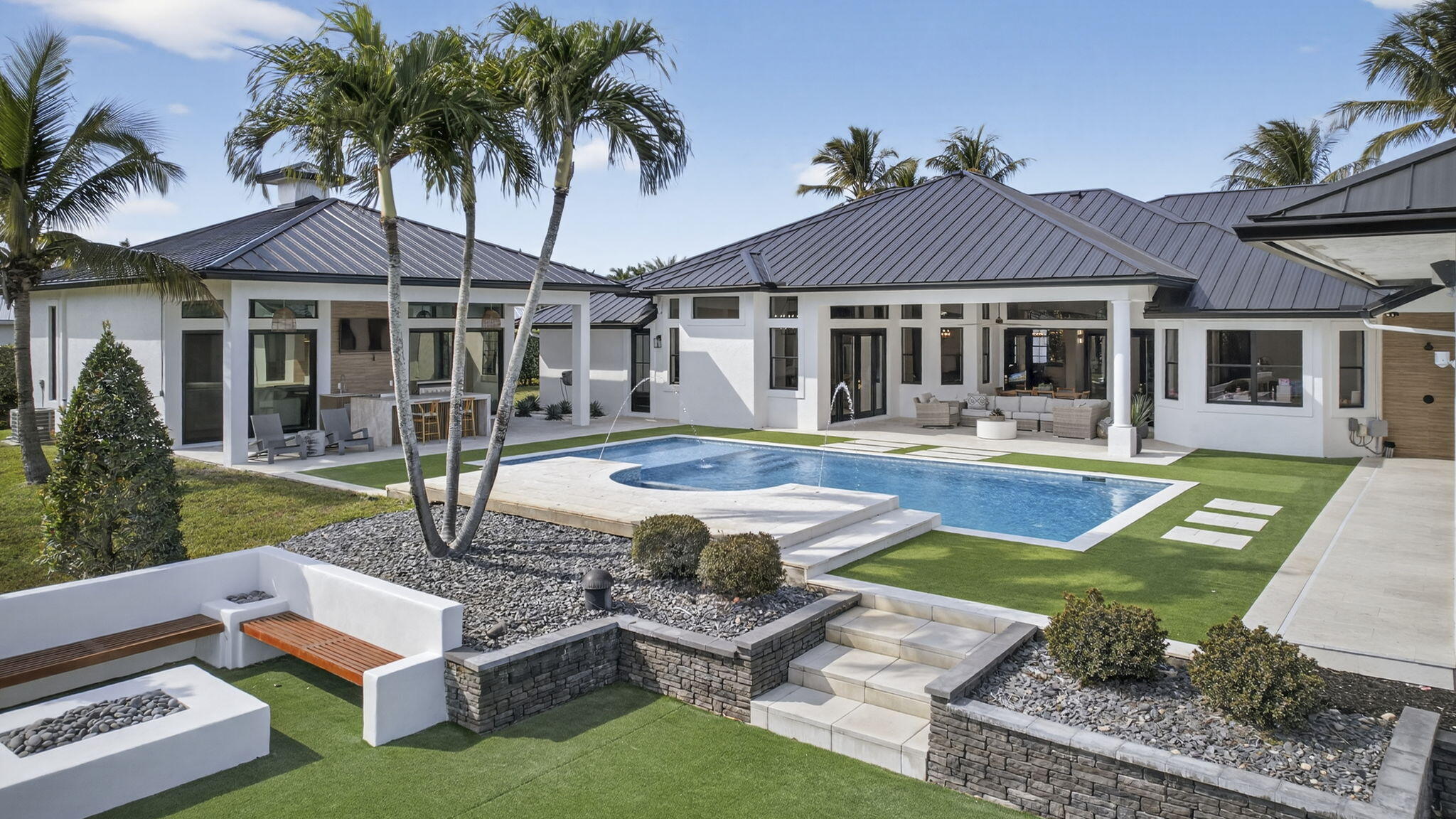 Fully renovated in 2025, this privately gated Aero Club estate offers approximately 6,500 SF of refined living space and over 8,300 SF total, with half the residence newly constructed and the remainder fully remodeled. Designed for elevated living, the home features a new metal roof, detached guest house, private pickleball court, media room, and a wellness suite with sauna, cold plunge, and gym. The chef's kitchen includes a butler pantry, gas range, and double laundry system. The primary suite offers a spa bath with steam room and walk-in closet. Executive office overlooks the heated pool. Hurricane-ready with a house generator powering the home and outdoor kitchen. Located near the entrance of the Aero Club with close proximity to horse farms, the dog park, and the private airport.