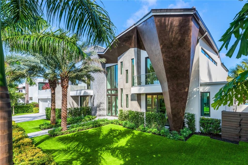 Perfect dockage for up to 100' yacht (9ft+/- low tide) on one of the most desirable Las Olas Isles! This Organically inspired deep water residence is both warm & inviting, offering a private resort style ambiance. Intriguing architecture & floorplan built to custom quality by Gulf Building. Oversized property allows for a more impressive pool area & expansive covered terraces for outdoor living. Immediately welcoming & offering a superior balance of formal & casual living areas, impressive Chef's kitchen, family room, bar area, wine cellar, 2 story living room, media room, VIP suite. Second level: Flexible loft/lounge, expansive bedroom suites & the ultimate Master Suite, large closets, spa style bath. Huge covered terrace, summer kitchen, lounge & dining areas. Garage bays allow for lifts