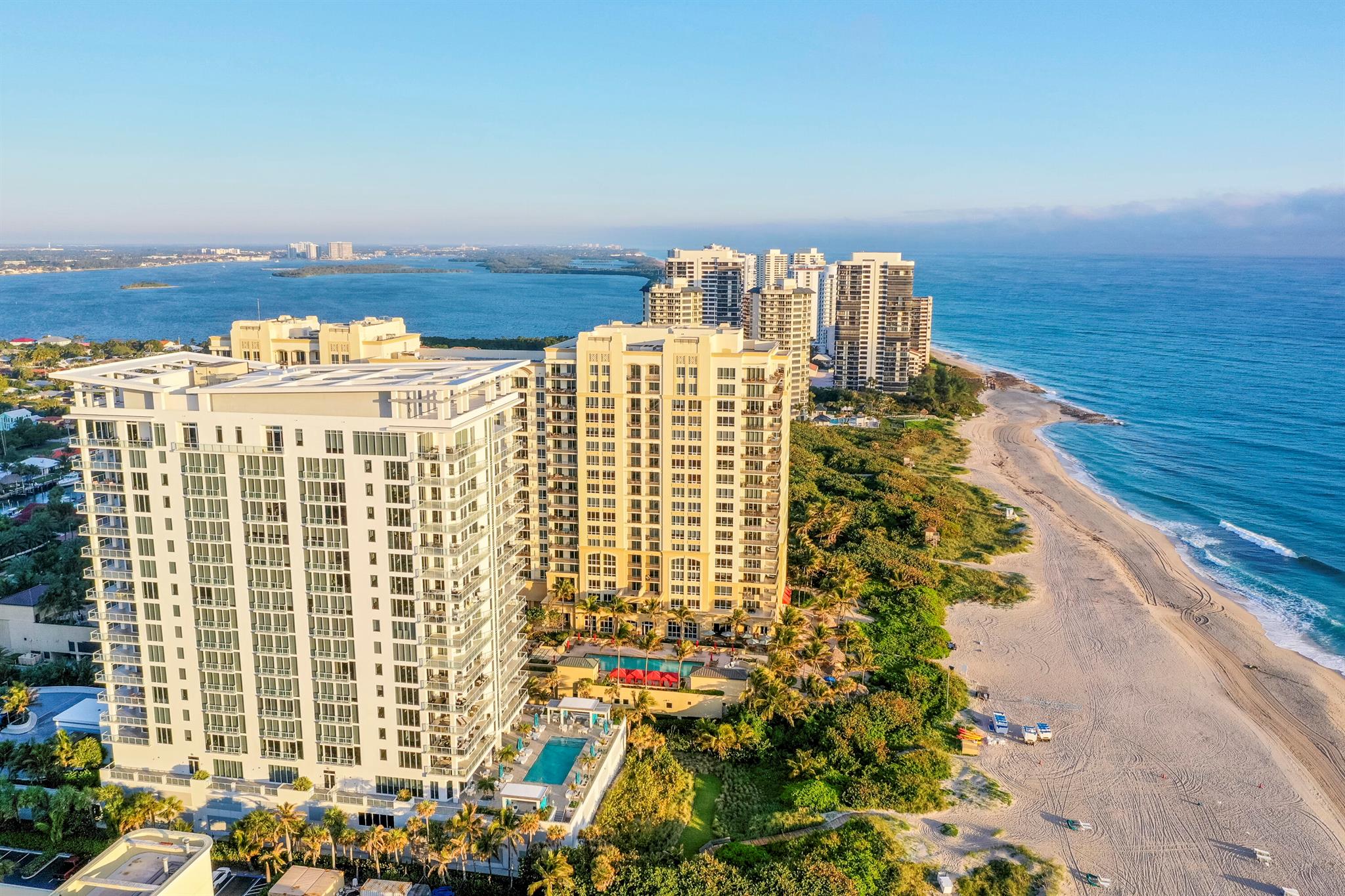 Welcome to elevated resort style oceanfront living at its finest. With sleek finishes and stunning ocean views, this incredibly appointed 4 bed, 4 bath condo enjoys a phenomenal location with easy access to shopping, culture & fine dining in the Palm Beaches. This unit sets the bar for luxury and elegance, with artistic wall features, 24 x 48 porcelain flooring, and modern accent lighting throughout. The chef's kitchen boasts top of the line miele appliances, double waterfall countertops, custom cabinetry, and a sleek contemporary fireplace. The primary suite enjoys direct ocean views, balcony access, and a beautifully appointed bathroom complete with soaking tub, dual vanities, and large tile porcelain. The oversized balcony wraps around the unit, offering unparalleled ocean views. from inside and out. Vista Blue is one of Singer Islands premier resort style buildings, with superior amenities including oceanfront pool & spa, grilling area, cabana service, wine bar w/ private storage, 24 hr staffed gate & lobby, and fully outfitted fitness center.