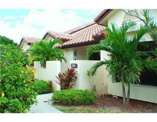 Move right into this beautifully maintained 3-bedroom, 2-bath villa in the heart of East Boca Raton. Bright, open, and spacious, this home features soaring cathedral ceilings, an inviting split-bedroom floor plan, and a full-size washer and dryer conveniently located inside the residence. Enjoy peaceful green space views from your private screened lanai, creating the perfect setting for relaxation and entertaining. Two assigned parking spaces are included. Located in a highly desirable gated community offering resort-style amenities, residents enjoy 24/7 manned security, two pools, two clubhouses, tennis courts, basketball and racquetball courts, a scenic jogging and biking trail, dog park, and picnic areas. Just 1.5 miles from the beach and within walking distance to FAU, downtown Boca  Raton, Mizner Park, and Royal Palm Place. Situated in a top-rated school district, this move-in-ready villa offers the ideal combination of location, lifestyle, and convenience. Rent includes cable and trash. No Pets  and non smokers please.