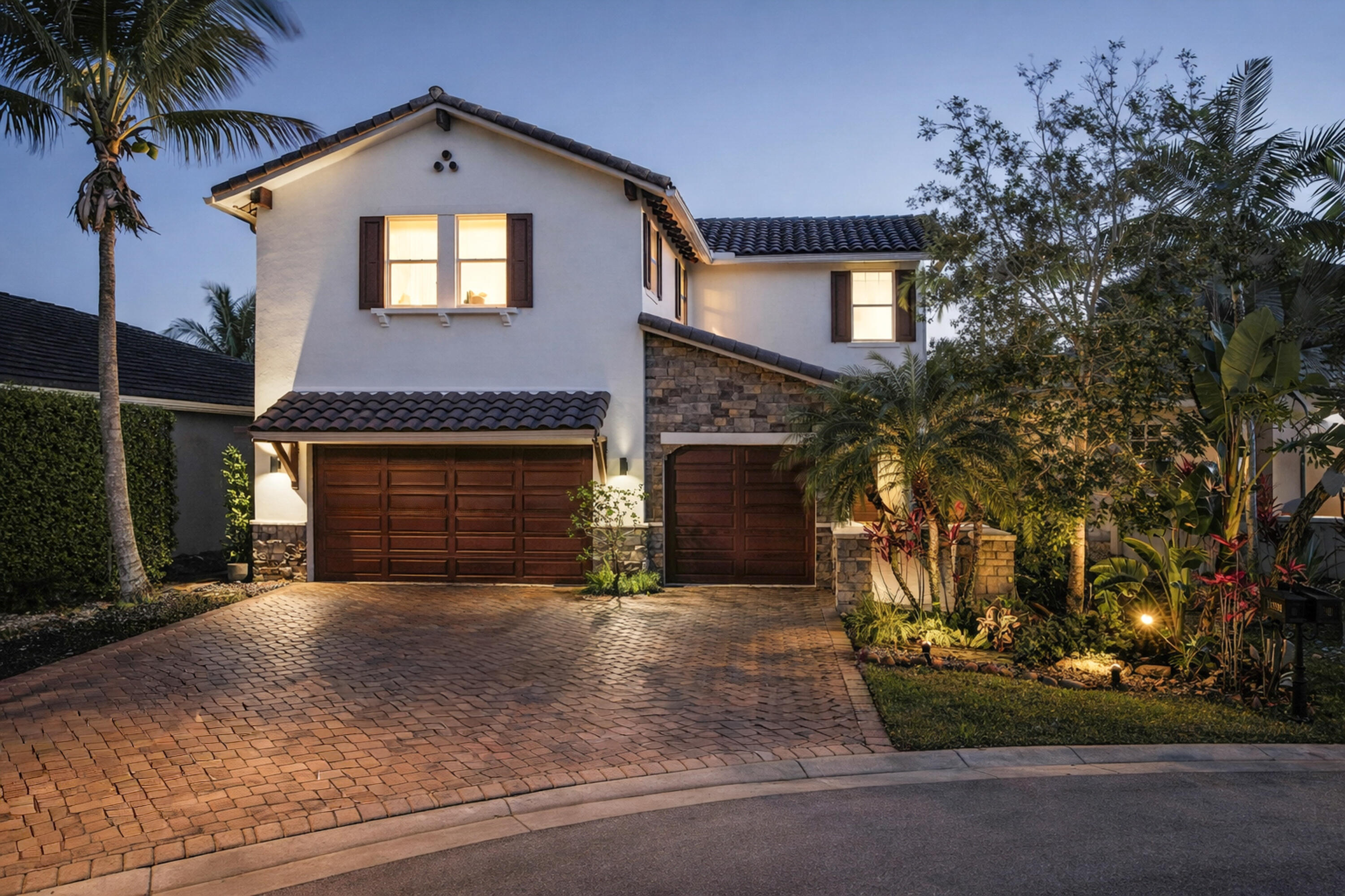 Set within one of Parkland's most desirable gated master-planned communities, this lakefront WCI/Lennar residence in Heron Bay combines elegant design, practical upgrades, and an easy South Florida lifestyle. Positioned on a cul-de-sac, the home offers 5 bedrooms, 4 full baths, an upstairs loft, 3,217 square feet under air, a 3-car garage, and an extended driveway that could comfortably accommodate several vehicles.  Outdoor living is a true focal point. A freeform pool with hardscape deck, in-pool sun shelf, and customizable lighting is oriented to capture wide, open lake views. The covered lanai serves as an extension of the main living area, with ample space for outdoor dining, entertaining, or simply relaxing poolside. The combination of cul-de-sac placement and offset homes along the shoreline helps create a secluded, quiet backyard setting.  Inside, the home features wood-look vinyl plank flooring throughout the main living areas and bedrooms for a clean, cohesive look. The kitchen offers generous countertop space, a large island suitable for casual dining, and a coordinated suite of KitchenAid appliances. Glass panels along the staircase preserve sightlines between levels while still defining the loft and common areas, and two of the five bedrooms offer en-suite baths and walk-in closets. Built-out closets throughout help maximize storage and organization.  Designed for everyday comfort and South Florida resilience, the home is constructed of concrete block with impact windows and doors, natural gas service (including an exterior connection), dual-zone air conditioning with Nest thermostats, and a tankless water heater. Recent improvements include a garage door motor with app and camera capability, a pool motor, an A/C unit, and a Samsung washer and dryer.  Residents of Heron Bay enjoy an amenity-rich lifestyle with access to two clubhouses, resort-style pools, modern fitness centers, tennis and pickleball courts, basketball courts, playgrounds, and walking paths, all within a 24-hour gated community. Parkland has been named the number one Best Place to Live in Florida by U.S. News for 2026-2027, recognized for its quality of life, schools, and overall livability.
