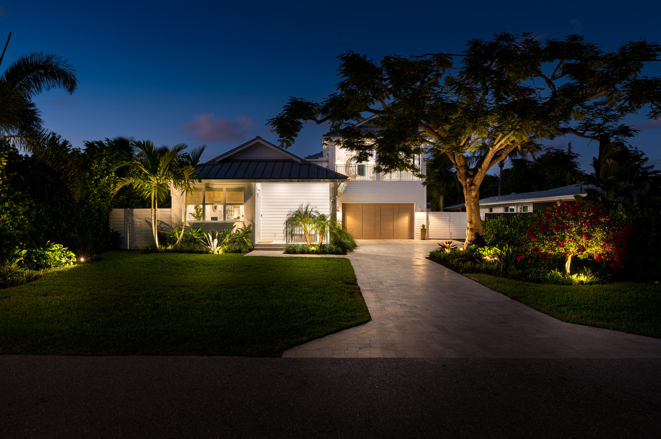 Discover a brand-new, exceptional 4-bedroom Key West style residence, situated on a serene tree-lined street just a short walk from the renowned Atlantic Ave. This fully furnished property comes complete with a street-legal golf cart. Every detail, from the quaint front porch to the unique finishes and secluded backyard, has been meticulously crafted with a designer's touch. Features include an outdoor shower, architecturally designed lighting, and a chef's kitchen  with natural gas. The retractable full-height glass doors lead to a summer kitchen overseeing a covered outdoor dining space and a luxurious pool. The fourth bedroom, if desired, can be divided to create a fifth bedroom with a private bath and its own balcony. Also multiple refrigerators, FH generator and putting green.