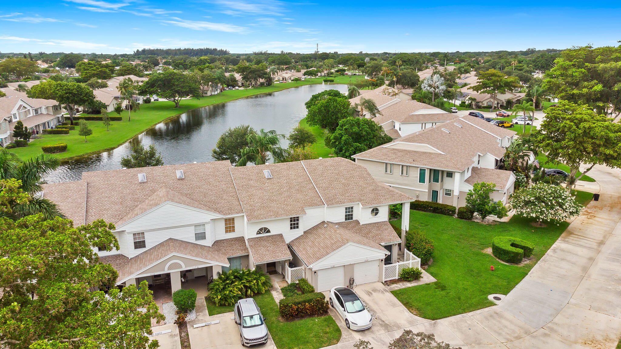 Experience a relaxing lifestyle with a beautiful lake view in one of Boca's top neighborhoods. This fully renovated home has three bedrooms and two and a half baths. The kitchen features new cabinets, a quartz countertop, and stainless-steel appliances. The interior is freshly painted, and all windows are impact-resistant except for the back sliding doors, which have shutters. The bathrooms have modern quartz vanities, and new LED lights brighten the whole house. The open layout gives you plenty of space to enjoy. The HOA takes care of the roof, exterior painting, and lawn, making life easier. High ceilings add a spacious feel.  You'll have access to three swimming pools, a fitness center, tennis and basketball courts, lots of sidewalks, and a playground. Top-rated schools, a library,  sheriff, and fire department are nearby, plus you can walk to Publix, Starbucks, and other shops. The HOA fees are low, and the home is ready for you to move in. It's wired for a portable generator, the water heater was replaced in May 2025, the HVAC was updated in 2018, and there's a WiFi garage door opener and thermostat. The home also has smart switches, flood lights, security cameras, a Ring doorbell, and a reverse osmosis water filter for the sink and fridge. Plus, there's a 220V EV outlet in the garage.