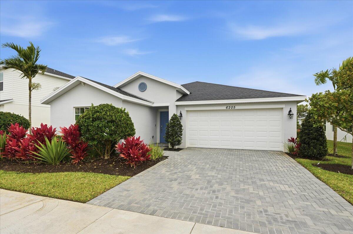 This stunning 4-bedroom, 2-bath home offers an open-concept layout, seamlessly connecting the kitchen, dining, and living areas. The owner's suite is ideally located in the back corner of the home with an en-suite bathroom. The home includes a convenient two-bay garage, stainless steel appliances, a gas range, quartz countertops, upgraded light fixtures and a Ring doorbell system. Beautiful clubhouse, fitness center, community pool, pickleball courts, playground, and more! Make this house your beloved family home!