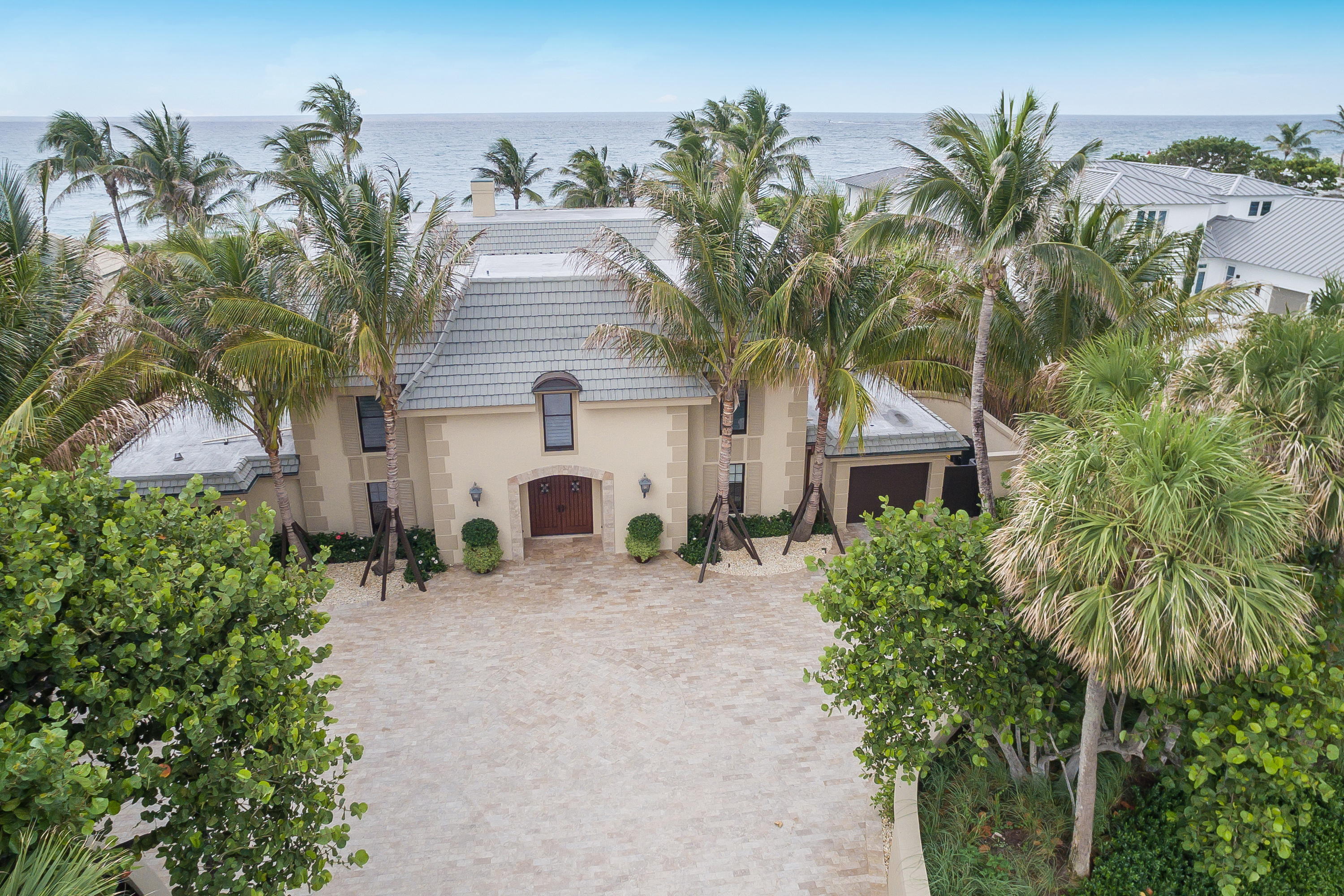 Paradise at Jupiter Inlet Colony!  Shorebreak is a beautiful 6 bedroom 6.5 bath beach home situated on one of the premier ocean front lots.   The half acre homesite is 21 feet above sea level. This high elevation puts it in flood zone C. It is lushly landscaped and is one of the deeper lots along the ocean in this highly sought after community, which was voted safest Florida Town in 2016.
 
Shorebreak was the former home of country music legends George Jones and Tammy Wynette.  Spanning over 6,400 square feet, this amazing beach house is perfect for creating lasting memories with family and friends.  Enjoy breathtaking ocean views of the crystal blue waters of the Atlantic Ocean. Paradise at Jupiter Inlet Colony!  Shorebreak is a beautiful 6 bedroom 6.5 bath beach home situated on one of the premier ocean front lots.   The half acre homesite is 21 feet above sea level. This high elevation puts it in flood zone C. It is lushly landscaped and is one of the deeper lots along the ocean in this highly sought after community, which was voted safest Florida Town in 2016.
 
Shorebreak was the former home of country music legends George Jones and Tammy Wynette.  Spanning over 6,400 square feet, this amazing beach house is perfect for creating lasting memories with family and friends.  Enjoy breathtaking ocean views of the crystal blue waters of the Atlantic Ocean. The gourmet kitchen features granite countertops, stainless steel appliances including 2 dishwashers, Subzero fridge and freezer, Thermidor Gas Stove, hood and Ice maker. Additional features include dual sinks, large island, recessed lighting and oversized tile flooring.
 
The spacious living room with sliding glass doors to the rear patio is the dramatic focal point of the home.  As one steps out these doors to the patio they experience the Florida beachfront living at its finest. Relax and enjoy the privacy and shelter of your courtyard pool or choose from a variety of activities such as fishing, kite surfing, paddle boarding, surfing, boating and more on your own backyard beach.
If you want a piece of paradise and the Florida lifestyle make Shorebeak your beachfront home.