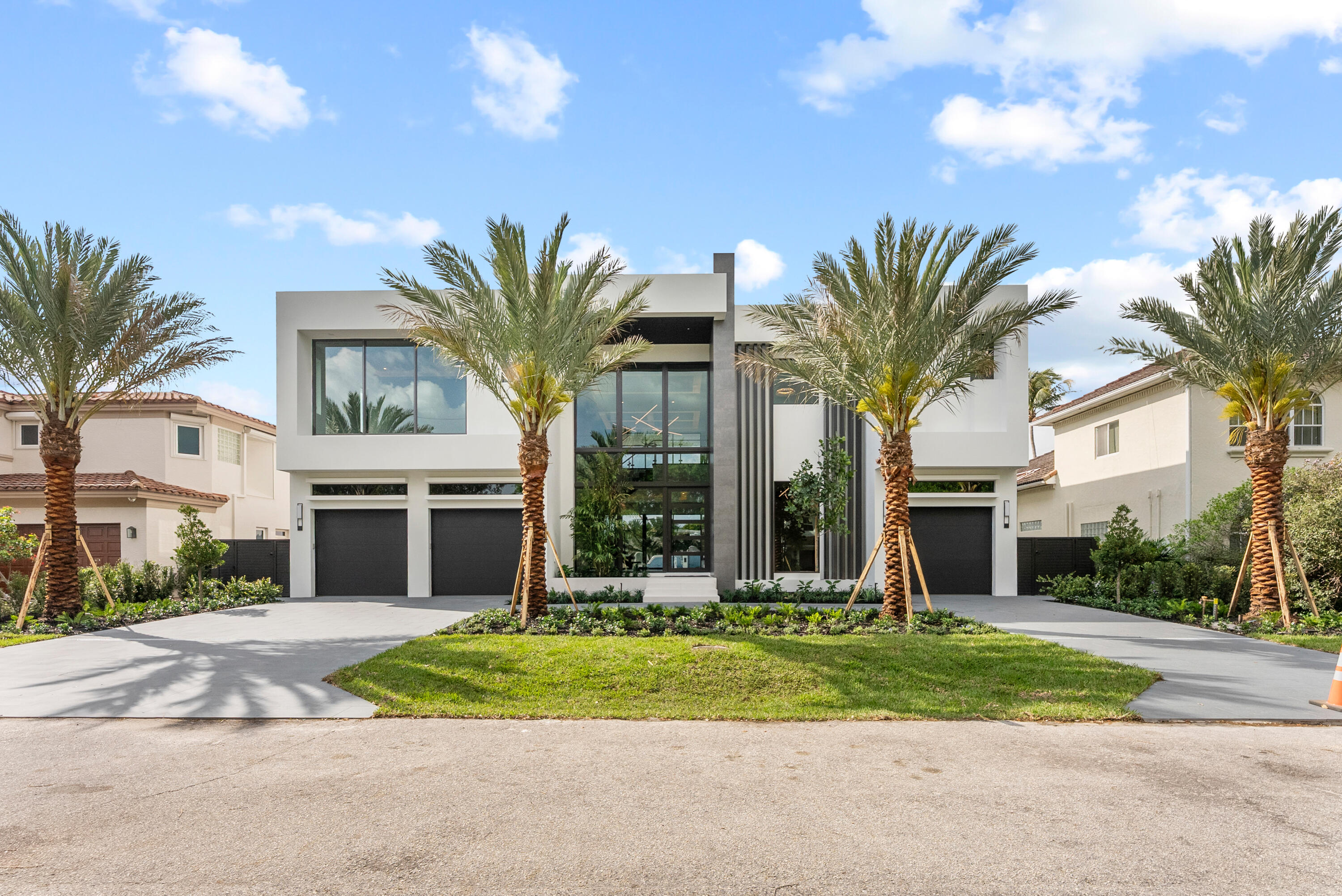 A must-see new construction waterfront estate, located in the highly desirable Tropic Isle neighborhood. This residence offers approximately 5,705 SF of living space. Featuring wide canal frontage with southern exposure, the property includes approx. 90 feet of waterfront, a new seawall, 70' concrete dock, and 24,000lb boat lift with quick Intracoastal and ocean access. Outdoor living includes a saltwater pool, oversized spa, and summer kitchen. Interior highlights include soaring ceilings, glass entry, impact windows and doors, open-concept living, chef's kitchen with Sub-Zero and Wolf appliances, quartzite countertops, wine feature wall, clubroom with bar, elevator, and second-floor lounge. Additional 48kW generator, home office, and ample storage.  Luxury Waterfront Living - Redefined Located in the heart of highly coveted Tropic Isle, this striking new-construction estate represents the pinnacle of modern waterfront luxury. Built with the finest materials, precision and artistry, every element of this home is designed to elevate the coastal lifestyle — from the wide canal frontage with southern exposure to its bold contemporary design, 5,705 SF of living space, and smart home integration.   Waterfront Perfection Enjoy 90 feet of prime canal frontage with a newly constructed seawall, stem wall, and cap, along with a 70' concrete dock and a 24,000 lb boat lift — offering immediate access to the Intracoastal and Atlantic Ocean beyond. The saltwater pool and oversized spa, paired with a fully equipped summer kitchen, create a true backyard oasis.   Sophisticated Interior Design Step inside to soaring ceilings, a grand glass front entry, and impact windows that flood the home with natural light. The open-concept layout is anchored by a chef's kitchen featuring Sub-Zero and Wolf appliances, quartz countertops, and a show-stopping wine feature wall. Entertain effortlessly in your clubroom with opulent bar. An elevator taking you or your guest to a second-floor lounge, and expansive living and dining spaces throughout  Thoughtful Amenities Smart home automation throughout Enjoy a luxurious and comfortable home office Wired for motorized shades Exposed mono-stringer floating staircase 48kW whole-house generator High elevation for peace of mind 2nd floor lounge Large interior storage closet Opulent Bar Elevator Wine feature wall This is more than a residence — it's a statement of style, strength, and South Florida living at its finest. With delivery expected upon completion of construction, now is the time to secure your place in one of Delray Beach's most desirable waterfront neighborhoods.