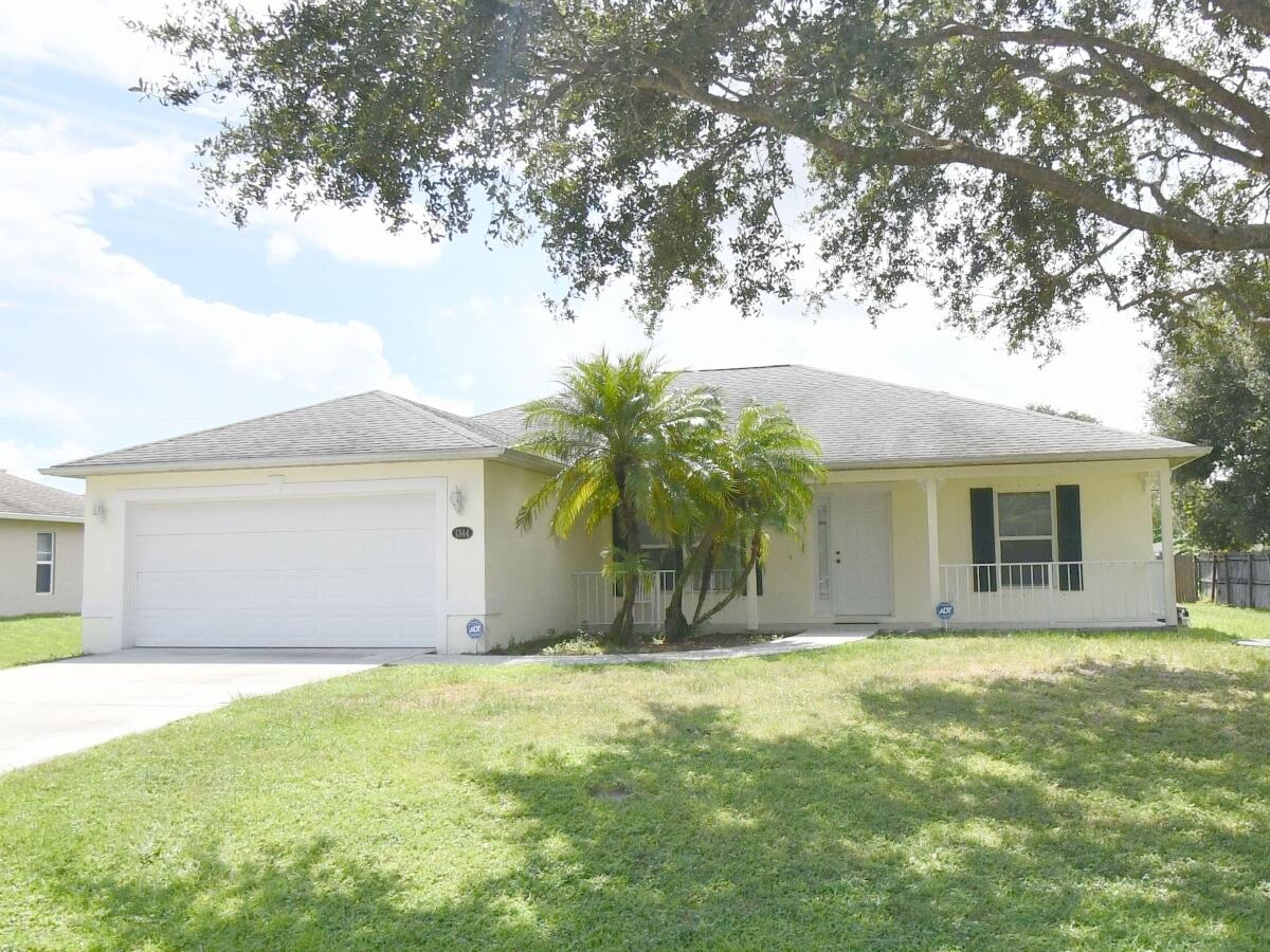 This well-maintained 3-bedroom, 2-bath CBS home, built in 2005, offers approximately 1,610 square feet of living space with a desirable split-bedroom floor plan designed for both privacy and everyday functionality.  Step inside to discover soaring vaulted ceilings, abundant natural light, spacious living and dining areas, and a thoughtfully designed layout that's perfect for families, retirees, first-time homebuyers, or anyone looking for a move-in-ready home in one of Port St. Lucie's most convenient neighborhoods.  The primary suite is a relaxing retreat featuring a large walk-in closet and a spacious ensuite bath with a Roman soaking tub and separate shower. Two additional bedrooms provide flexibility for guests, a home office, or growing family Hurricane shutters and a security system add extra peace of mind.  Enjoy Florida's outdoor lifestyle from the screened patio overlooking the backyard—ideal for morning coffee, weekend BBQs, or simply relaxing after a long day.  Why You'll Love This Home:  3 bedrooms | 2 bathrooms Split-bedroom floor plan Spacious primary suite with Roman tub Walk-in closets Vaulted ceilings Screened patio Hurricane shutters Two-car garage CBS construction No HOA  Location is everything, and this home delivers. Conveniently located near schools, shopping, restaurants, parks, medical facilities, and major commuter routes, you'll enjoy quick access to I-95, the Florida Turnpike, Tradition, St. Lucie West, golf courses, beaches, and all the recreation the Treasure Coast has to offer. The home is also within walking distance of Oak Hammock K-8 School.  Whether you're searching for your primary residence, seasonal Florida retreat, or an investment opportunity, this property offers outstanding value in one of Port St. Lucie's fastest-growing communities.
