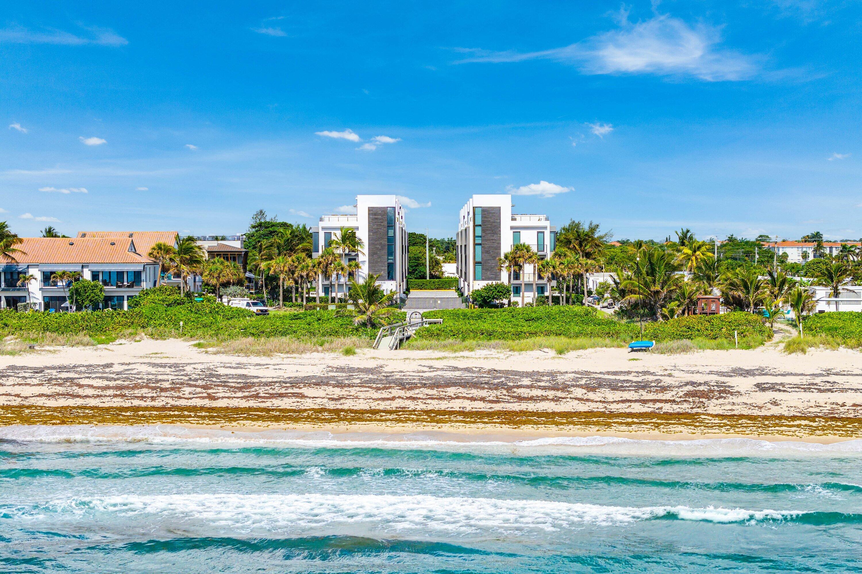 Located in the gated oceanfront enclave of Gulf Stream Views, this stunning 4-bedroom townhome, completed in 2021, boasts 3,386 sq ft, a private elevator, heated saltwater pool, rooftop terrace, and stunning ocean views. Designed by Richard Jones, this refined coastal residence features floor-to-ceiling impact glass, smart home technology, electric shades, hardwood flooring, built-in speakers, and high-end finishes throughout. The open living level offers a European-style chef's kitchen with quartzite counters, custom cabinetry, Wolf, Sub-Zero, and Bosch appliances, wine refrigeration, and ocean views. Enjoy a flexible VIP suite, private balconies, rooftop summer kitchen with retractable awnings, 2-car garage, and private beach access in an intimate 14-residence pet-friendly community. The first level features an oversized two-car garage with built-in storage, a laundry room, and a spacious family room complete with a morning bar, walk-in closet, and ensuite bath. An additional door enhances the flexibility of this space, allowing it to serve as a private VIP guest suite. The ground level opens to a walled-in outdoor retreat with a heated saltwater pool and outdoor shower, creating a serene and private escape just steps from the beach.  The second level is designed for elevated everyday living and entertaining. The open-concept kitchen, dining, and great room are framed by floor-to-ceiling impact glass, capturing spectacular ocean views and an abundance of natural light. The European-style chef's kitchen is appointed with quartzite countertops and backsplash, an oversized island, custom wood cabinetry, Wolf induction cooktop and oven, Sub-Zero refrigerator, Bosch dishwasher and microwave, wine refrigeration, and generous storage. This level also includes a private guest suite with walk-in closet and ensuite bath, a designer powder room, and a balcony overlooking the coastal setting.  On the third level, the primary suite offers a true private sanctuary with ocean views, a spacious bedroom, private balcony, walk-in closet, and a spa-inspired bath featuring dual vanities, a walk-in shower, and separate soaking tub. An additional guest bedroom with ensuite bath, ample closet space, and a second laundry area complete this level.  The fourth floor is one of the home's most impressive spaces, featuring a covered portico ideal for a private office, lounge, or bar area, along with an expansive rooftop deck designed for unforgettable entertaining. Outfitted with retractable awnings on all sides and a luxurious summer kitchen, this rooftop retreat is perfect for sunrise coffee over the Atlantic, sunset cocktails with Intracoastal views, or hosting guests while enjoying the ocean breeze.  Additional features include smart home technology, electric shades, retractable screens for indoor-outdoor coastal living, hardwood flooring, built-in speakers throughout, high-end finishes, and exceptional attention to detail on every level.  Gulf Stream Views is an intimate, gated oceanfront community of only 14 luxury residences located along prestigious Old Ocean Boulevard, just minutes from Palm Beach and Downtown Delray Beach. The pet-friendly community offers private beach access, a boardwalk, and an outdoor shower, creating a rare opportunity to enjoy true beachfront living in one of South Florida's most desirable coastal settings.