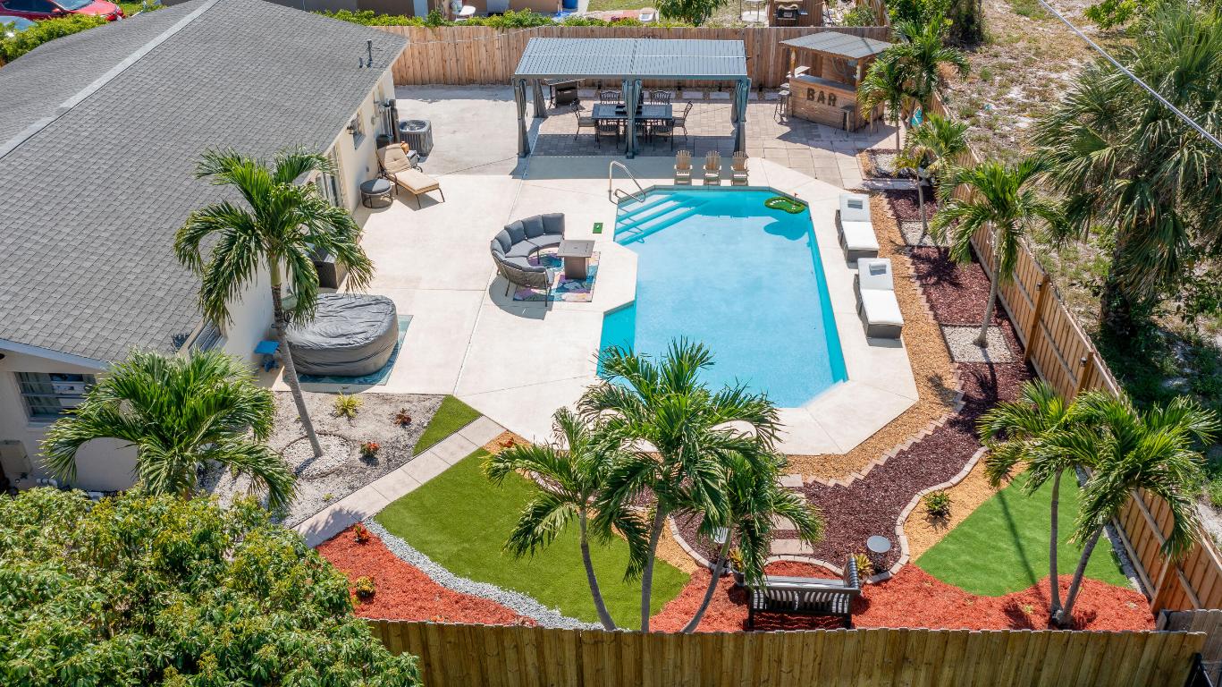 Welcome to this charming 4-bedroom, 2-bath home located in the heart of Lantana. Ideally situated just minutes from beautiful beaches, vibrant nightlife, dining, and shopping, this property offers the perfect blend of comfort and convenience. The home features a stunning resort-style backyard with no homes built behind, providing exceptional privacy and a peaceful outdoor retreat. Nestled in a quiet neighborhood, this property is ideal for families or investors alike. Currently operating as a successful short-term rental, the home is fully up to code and ready for continued income potential or personal enjoyment. A rare opportunity to own a versatile property in one of Lantana's most desirable locations.