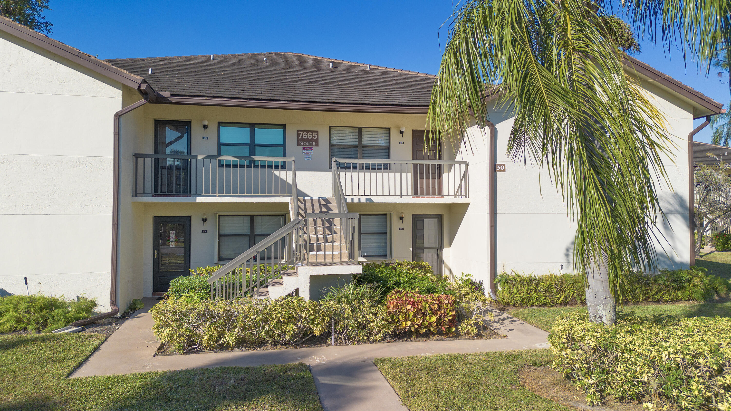MOVE-IN-READY! First floor corner unit across from the community pool. Beautiful Lucerne Lakes 55+ community. Very quiet and clean. Totally remodeled and open concept partially furnished with quartz countertops, Bosch and Kitchen-Aid appliances. Washer and Dryer are on the enclosed patio. Master bedroom has beautiful white French doors, great walk-in shower and walk-in closet with custom shelving. Clubhouse and pool across the street and many very nice amenities in the complex. 750 Credit score required.