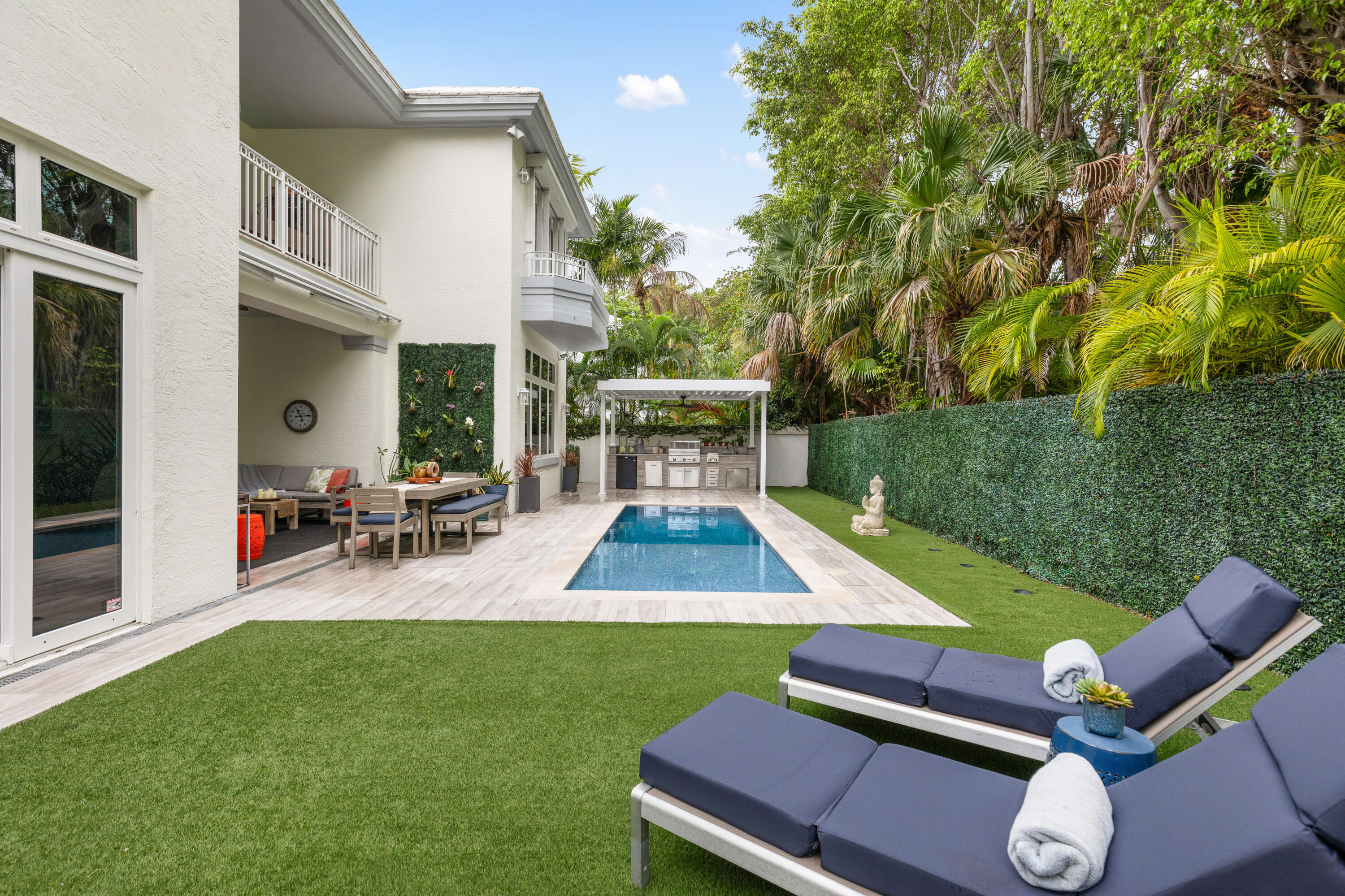 Experience island living at its best in this renovated 4,220SF estate within Grand Bay Estates, Key Biscayne's only guard-gated single-family enclave! This 5BR/5.5BA home features a 2021 roof, new tankless water heaters, new AC units and full storm protection! The kitchen shines with Quartz counters & Sub-Zero, Wolf, & Miele appliances, plus a dual-zone Sub-Zero wine fridge. The versatile layout includes all en-suite bedrooms, staff quarters, & private in-law suite with its own entrance. A rare find for Key Biscayne is the climate controlled 2-car garage plus golf cart garage. The backyard oasis offers a heated saltwater pool, summer kitchen & retractable awnings, perfect for entertaining! HOA covers lawn care, 24hr security, pool maintenance, pest control, plus private park & playground! For the ultimate experience in luxury and privacy, look no further!