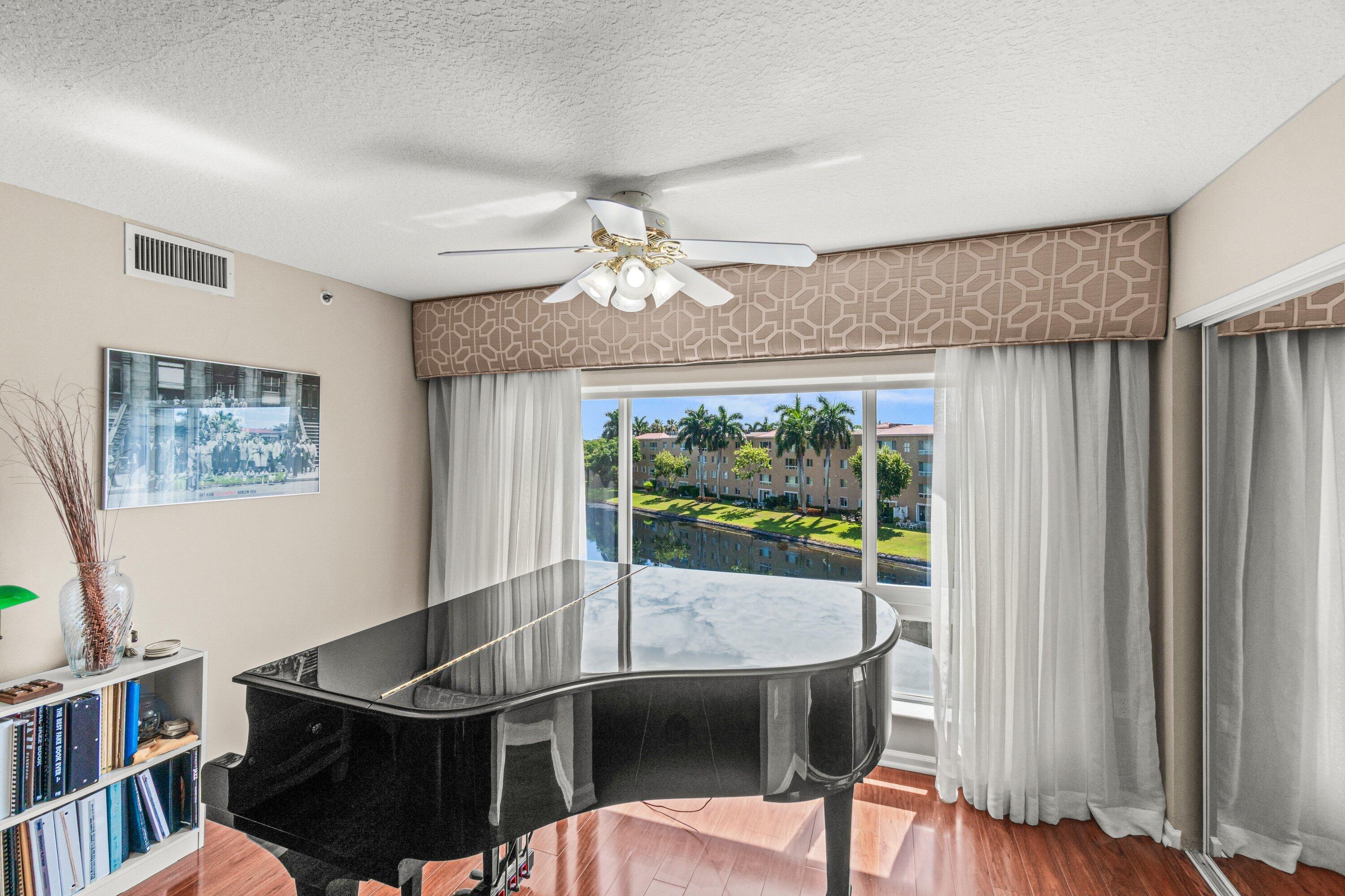 Welcome to this top-floor penthouse waterfront condominium in Coral Cove Condo, Boynton Beach. This desirable end-unit residence offers 3 bedrooms, 2 bathrooms, and 1,869 square feet of bright, airy living space, enhanced by extra windows that fill the home with natural light and showcase the surrounding views. The thoughtfully designed floor plan makes efficient use of the available square footage, providing comfortable proportions for modern living. Throughout the home, you'll find all wood and tile flooring, granite countertops in the kitchen and bathrooms, and numerous recent upgrades, including a new hot water heater, two new ADA-compliant toilets, a new main water ball valve, and an instant hot water system at the kitchen sink. For added peace of mind, storm shutters are installed on all windows. The property also includes covered parking and access to a dedicated bike storage room.  Ideally situated within the community, this waterfront condominium is very close to the tennis and pickleball courts as well as the clubhouse, offering convenient access to Coral Cove Condo's amenities and lifestyle. This exceptional penthouse presents a wonderful opportunity to enjoy waterfront living in Boynton Beach.