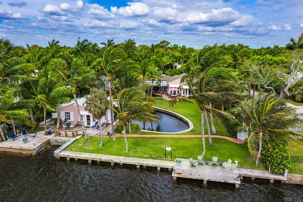 A rare and exceptional opportunity to acquire a direct Intracoastal compound in the heart of Delray Beach, this estate, consists of two separate parcels, 904 & 910 NE 4th St. The compound is comprised of three separate houses and exudes a timeless charm and warmth that is ready to enjoy now or if you fancy, indulge your creative side by designing your dream home on one or both parcels. The main house features 3 bedrooms and 3 plus bathrooms with 3,334 Total sqft, a spacious living/dining room, large gourmet kitchen with breakfast area, an inviting family room and a cozy cypress paneled den, all with sweeping wide water Intracoastal views. The direct Intracoastal cottage features one bedroom, living room with fireplace, kitchen, and a wraparound deck on the water. The third cottage features a bedroom and bathroom. Close to the beach and Atlantic Avenue this is an incredible offering that is here now and gone tomorrow.