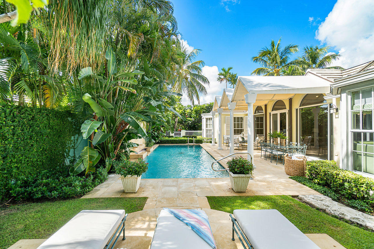 Classic Bermuda style home dripped in elegant & airy island-chic designs by Kemble Interiors. A timeless floorplan allows for both casual and formal living in a tropical setting, with floor to ceiling windows that seamlessly flow to an exterior loggia & luxurious pool area. This north end home is manicured & exquisitely maintained and sits at finish floor elevation of 8.6. Spend your days immersing yourself in the tropical Palm Beach lifestyle at 255 Plantation Road.