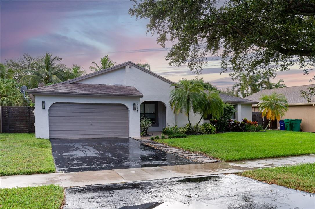Roofs are like diets; everyone knows they need one but nobody wants to deal with it. Good news: this one is already being handled for you. Welcome to this tastefully renovated 3 bedroom, 2 bath Cooper City gem where the hard work is done and the good life is ready to begin. Impact windows and doors (except garage door) throughout mean you can sleep through a storm like a champ while your neighbors are still taping Xs on their glass. The sparkling pool and gorgeous backyard deck are begging for an afternoon with nowhere to be. nside, the renovations are tasteful, the layout is functional, and the vibes are immaculate.  Now for the part that actually sells homes: Griffin Elementary, an A-rated school, is a short walk away; your future middle and high schoolers are also covered with A-rated schools across the board. Speaking of walking; a park is steps from your front door, complete with a walking path, open play area, sand volleyball court, and playground. Major highways, shopping, houses of worship, and everything in between round out a location that truly has it all. Some homes make you settle. This one makes you stay.