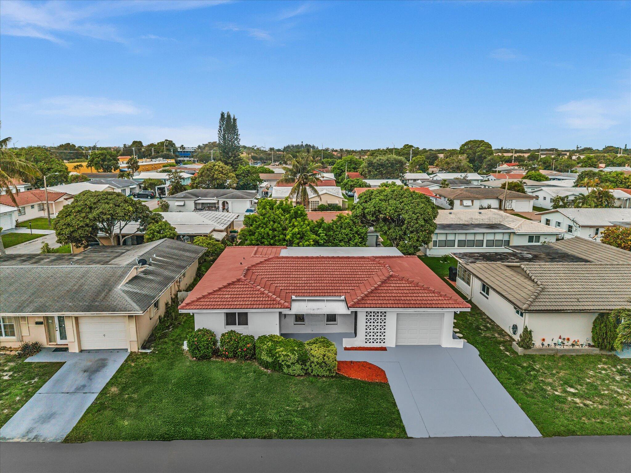 So much room in this beautifully maintained home located in a desirable 55+ community with a low HOA! This spacious residence features a large family room, an eat-in kitchen, generously sized bedrooms, and plenty of room to relax and entertain. Recent upgrades include a BRAND NEW ROOF,  impact windows and doors, and accordion shutters on the rear sliding door for complete hurricane protection. The interior has been freshly painted, and both bathrooms have been  remodeled. Enjoy the benefits of a low monthly HOA fee of just $70, which includes lawn care, sprinkler service, community pool, and clubhouse access. Conveniently located near shopping, dining, and major highways. A must-see home offering comfort, value, and peace of mind!