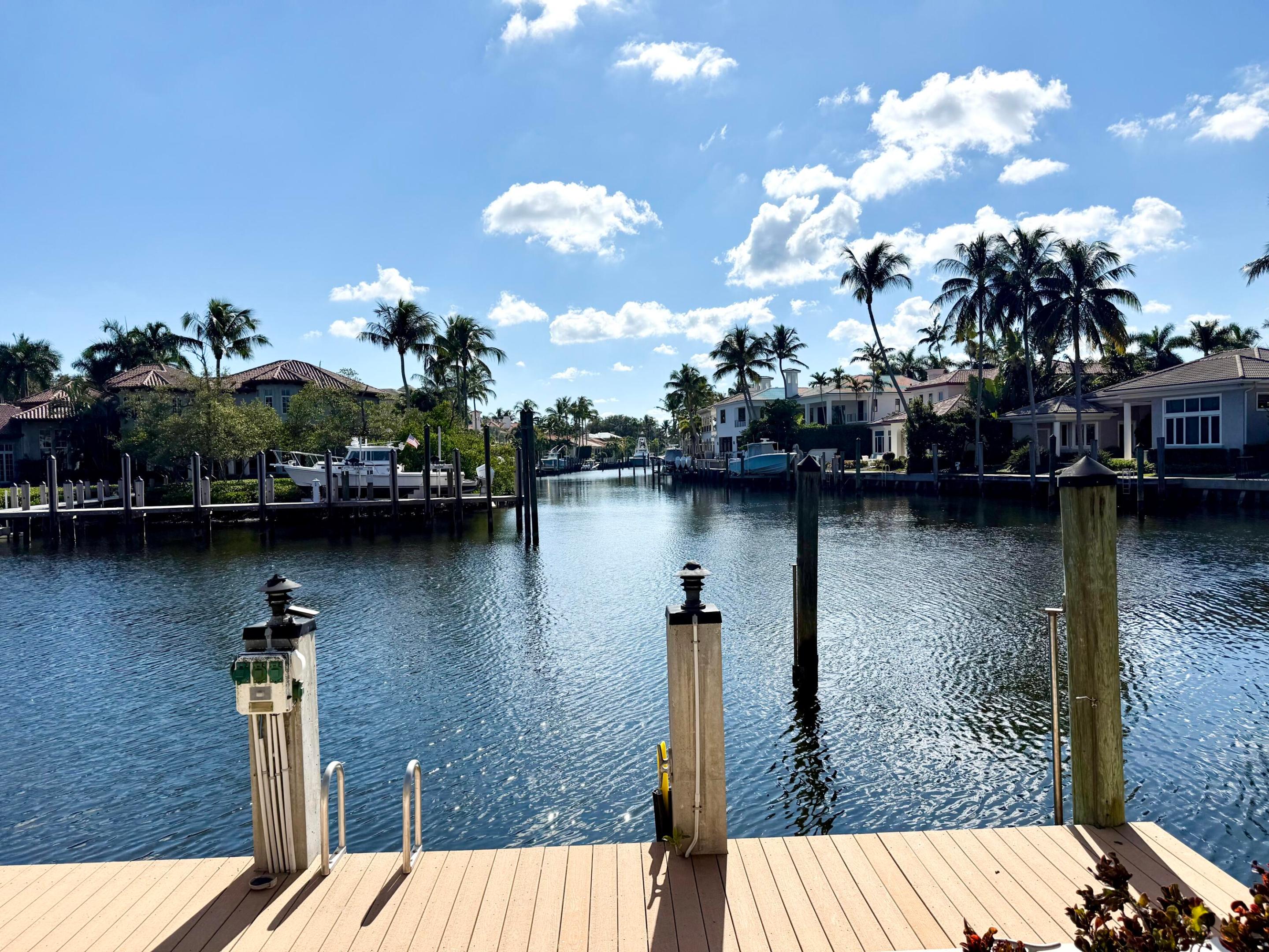 PRICED BELOW APPRAISED VALUE! Boutique gated waterfront community Harbour Isles offers luxury living. Prime Location. Expansive water views. 26KW full house generator. Minutes to Intracoastal. Room for 70ft yacht.  Trex Dock w/water, 100 Amp electric. Recently updated residence w/5 spacious bedrooms, office w/Builtins. 5.2 luxurious baths. Primary first floor owners suite boasts his/her baths, 2 walk in custom closets, wood floors. Chefs kitchen w/crystalline countertops, breakfast island, gas cooktop, top appliances. Resort style beach entry heated pool/spa w/south exposure. Summer kitchen. Features include impact windows/doors, marble floors, bar w/icemaker, sink and fridge, Volume ceilings. Marble staircase with 2 addl VIP suites,large loft. Close to beach, Gardens Mall, PBI airport Priced to sell quickly !!