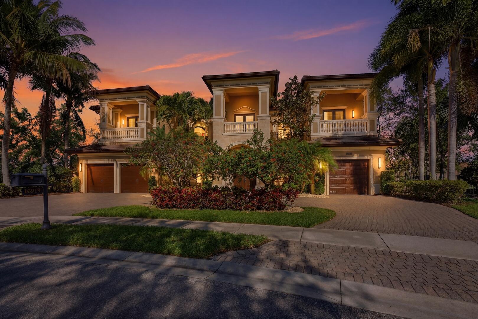 Welcome to one of the most exceptional homes in The Bridges—a truly one-of-a-kind, custom-modified Chantilly designed for luxury, comfort, and impact. Positioned on a private cul-de-sac, this home sits on the largest pie-shaped lot in the community, offering unmatched privacy and breathtaking long lake views with a stunning fountain backdrop. From the moment you enter, the home opens with a grand, light-filled feel, finished with elegant Corsican marble flooring and designed to draw your eye straight to the water. The outdoor space is where this property separates itself—featuring a heated pool, expansive entertaining areas, and a custom putting green, all set against a wide, tranquil lake view that defines South Florida living.  The kitchen is a true centerpiece, built for both daily living and entertaining, with top-of-the-line Viking and Sub-Zero appliances, custom cabinetry, and generous prep space. The main-level primary suite is a major advantage, offering a private retreat with sweeping lake views and dual spa-style baths.  Professionally designed by Nikki Levy Interiors, the home carries a clean, modern, model-like feel throughout. The first floor also includes a private office, guest suite, spacious great room, formal living room, and custom bar. Upstairs, a wrought-iron staircase leads to a large loft, oversized bedrooms, a fully equipped theater room, and a dedicated gym.  With smart home technology and a full-house generator, this home delivers both luxury and peace of mind. This is not just another home in The Bridges—this is one of the best lots, layouts, and opportunities in the community.