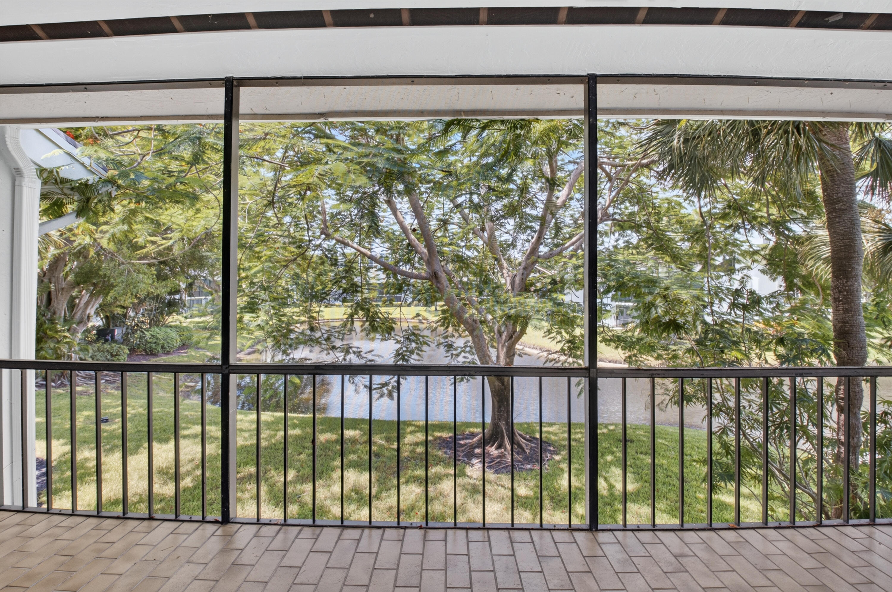 Updated 3-bedroom, 2.5-bath garden apartment with high ceilings and abundant natural light. Enjoy beautiful water views, including a picturesque lake view from the kitchen window.  This home features recessed lighting throughout, new appliances, A/C, and a brand-new roof. Being sold fully furnished, it is truly move-in ready—just bring your personal belongings and start enjoying the season.  Purchase before October 1st and avoid the upcoming $75,000 increase in club fees. Lakewood is a wonderful community, known for its exceptional management and enjoyable lifestyle.  Relax to fabulous, sweeping water views in a prime location just a short stroll or golf cart ride away from Boca West's premier dining, fitness center, pools, and vibrant club activities including the new 25-court pickleball