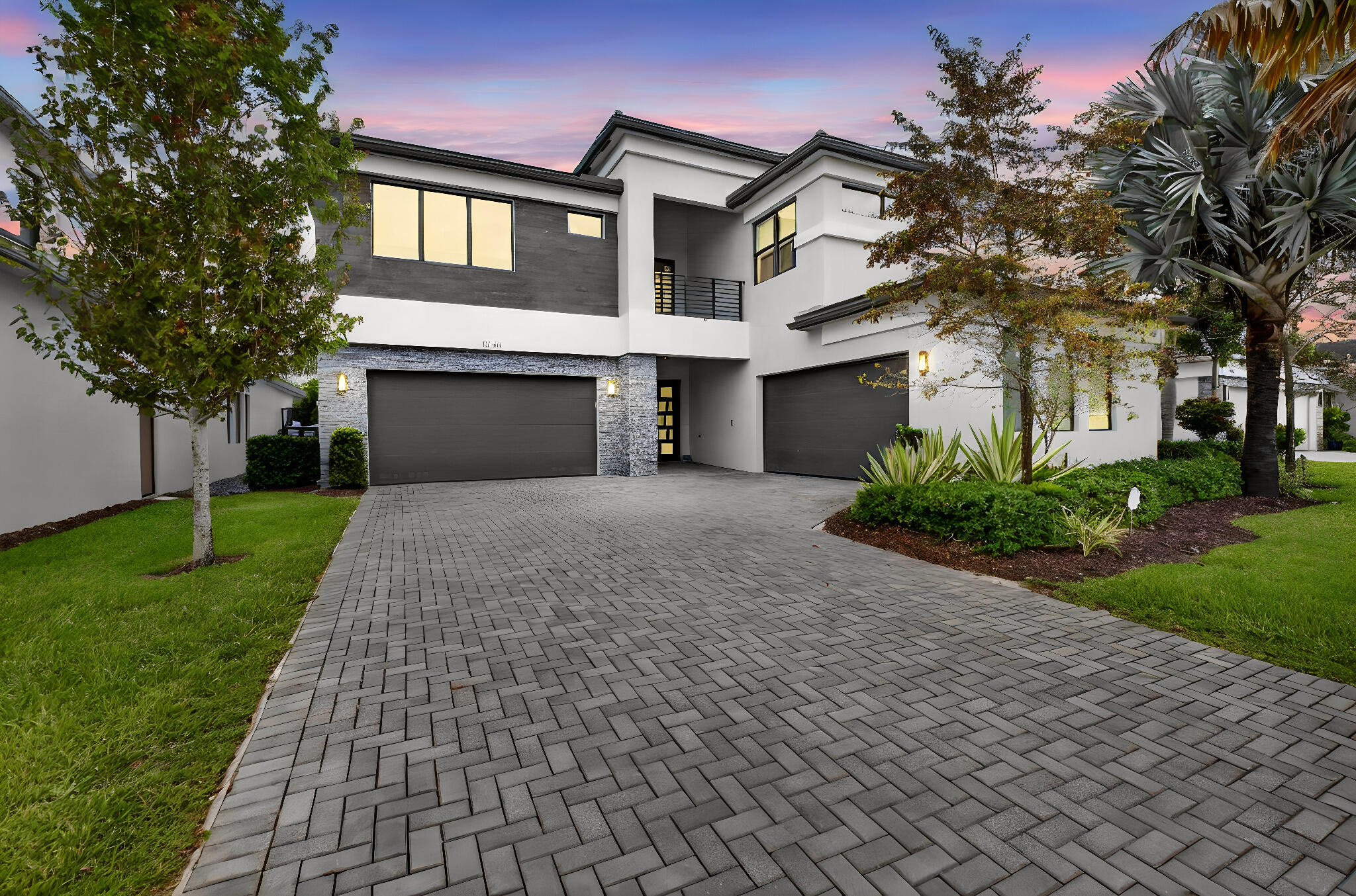 This uniquely customized Maldives model is a one-of-a-kind masterpiece. 5 bdrms, 5.2 bths, den+office, media room, loft, 4 car garage. The floor plan was thoughtfully re-imagined with a wall removed to expand the kitchen & dining area into one generous space. The club room features a wet bar with custom cabinetry & a full-size wine refrigerator. The chef's kitchen is exquisitely crafted, with made-to-order cabinetry, designer fixtures, & high-end Dacor appliances. You can enjoy the view from the screened balcony. Fully outfitted closets in the bedrooms. The bathrooms have been redone with luxury finishes; the primary bath features a steam shower. The oversized backyard provides abundant space & large pool. The patio is a serene retreat with phantom screens & rich wood ceilings. Lotus is one of the finest resort-style, luxury home communities in West Boca Raton by leading home builder, GL Homes. This exclusive gated community features contemporary and ultramodern home designs. Lotus Boca Raton offers residents a sophisticated lifestyle with world-class amenities. This home is a flawless blend of elegance, sophistication, & meticulous craftsmanship—a true gem for the for the luxury buyer seeking the finest in design & quality. EXCLUSIONS: Media room TVs, chairs & equipment. Additional Features Worthy of Note: Light fixtures are INCLUDED. Architectural Changes from Builder's Plan: Club Room divided into 2 spaces to include an office. Glass sliding door added to kitchen. Wall removed between dining room & kitchen to create large, open area. Custom Bar with full sized Subzero wine refrigerator. Pre-wired outside for future summer kitchen. Sonos sound system indoors & out. Air conditioning in 1 of the 4 garages. Kitchen: 2 separate sinks, pot filler at cooktop, hood, Insta hot, glass sliders to the patio. Toto toilet in master bath. Motorized phantom screens on patio & balcony. Approval to expand driveway 2 ft. on left & 4 ft on right received from HOA. Putting green.