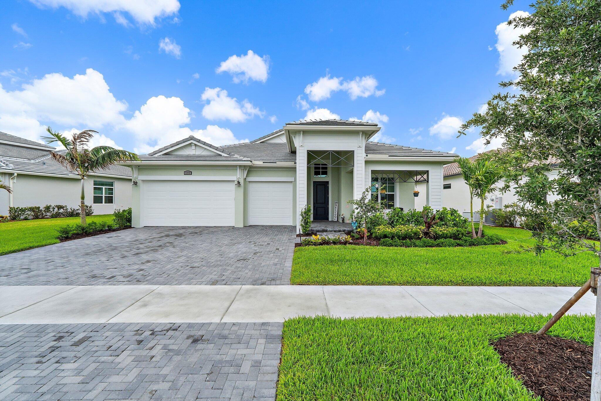 Welcome to this stunning 2025-built Kolter Paige model home, a beautifully designed 4-bedroom, 3-bath home with a 3-car extended garage, perfectly positioned with serene preserve views both front and back. Showcasing model-like elegance, this home features tile flooring throughout and a thoughtfully designed open layout ideal for both everyday living and entertaining.  The gourmet kitchen is a true centerpiece, complete with quartz countertops, stainless steel appliances, two built-in ovens, a gas range, and a spacious walk-in pantry with custom shelving. Generous closets throughout the home also feature custom shelving for exceptional organization.  Step outside to your fenced backyard oasis with ample space while enjoying peaceful natural surroundings. This home checks all the boxes