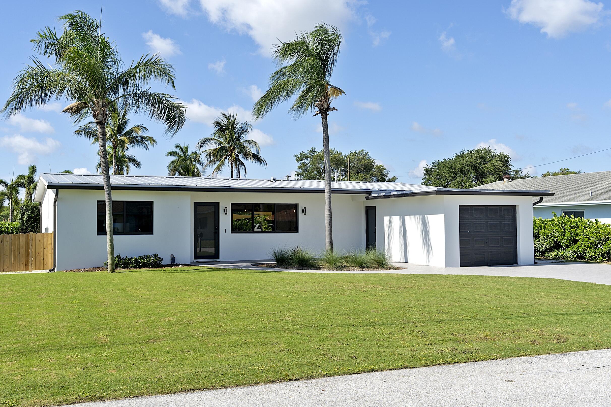 Nothing was overlooked. This home was remodeled from top to bottom. You will be happily blown away when you enter this well thought out home. New kitchen and baths, flooring, lighting, electric, plumbing, impact windows and more. Enjoy the pool area, pick some fruit or catch a fish in your back yard. It would be hard to find another one as nice and clean as this. Florida lifestyle at its best!