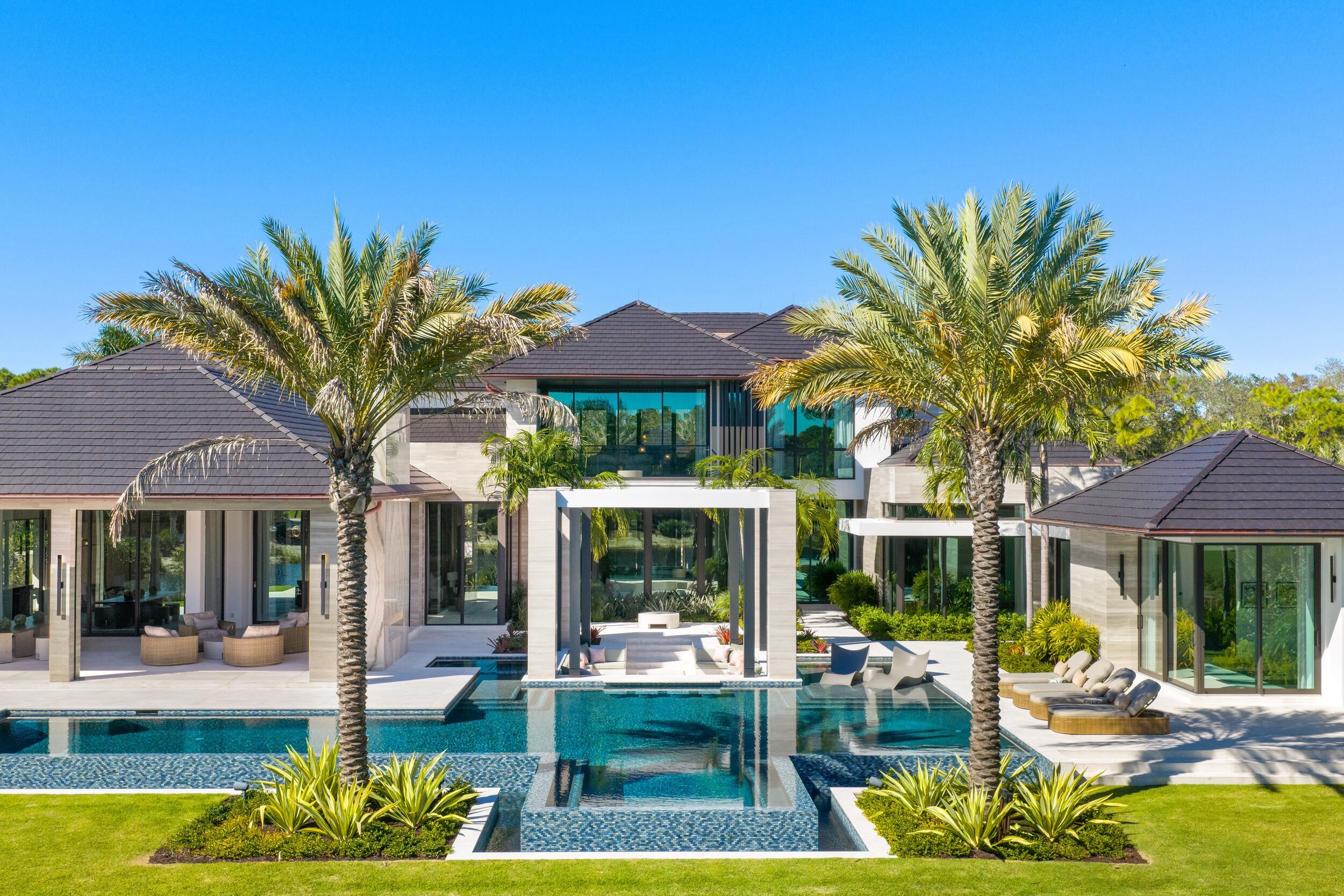 Set within the prestigious gates of The Bears Club, 228 Bears Club Drive is an exceptional estate that captures tranquil water vistas and sweeping golf course views, blending enduring craftsmanship with elevated modern luxury.

This six-bedroom residence, offering eight full and two half baths, is built for both permanence and peace of mind, featuring a rare 100-year roof and extensive, state-of-the-art security. The interiors reflect a level of detail rarely seen, with hand-crafted Italian doors and hardware, luminous Chippolino marble imported from Italy throughout, a private elevator, and a fully integrated Lutron lighting system. Three bio-fuel fireplaces provide elegant, toxin-free warmth throughout the home. Designed for seamless entertaining, the culinary spaces include Sub-Zero and Wolf appliances, a separate fully appointed chef's kitchen, and a 1,600-bottle, temperature-controlled wine cellar, complemented by a private theater for intimate evenings. The primary suite is a serene retreat, complete with separate his-and-hers bathrooms and expansive custom closets.

Outdoors, the estate unfolds into a resort-style sanctuary with expansive covered living areas, a pool and spa with four heaters for year-round enjoyment, and a fully equipped outdoor kitchen, all overlooking the quaint water feature and manicured fairways. With staff living quarters, two laundry rooms, a dog wash station, and a five-bay garage, 228 Bears Club Drive offers a lifestyle of quiet luxury, privacy, and distinction in one of South Florida's most coveted golf communities.

DISCLAIMER: Information published or otherwise provided by the listing company and its representatives including but not limited to prices, measurements, square footages, lot sizes, calculations, statistics, and videos are deemed reliable but are not guaranteed and are subject to errors, omissions or changes without notice. All such information should be independently verified by any prospective purchaser or seller. Parties should perform their own due diligence to verify such information prior to a sale or listing. Listing company expressly disclaims any warranty or representation regarding such information. Prices published are either list price, sold price, and/or last asking price. The listing company participates in the Multiple Listing Service and IDX. The properties published as listed and sold are not necessarily exclusive to listing company and may be listed or have sold with other members of the Multiple Listing Service. Transactions where listing company represented both buyers and sellers are calculated as two sales. "No payments made until title passes" Some affiliations may not be applicable to certain geographic areas. If your property is currently listed with another broker, please disregard any solicitation for services. Information published or otherwise provided by seller, listing company or its representatives is deemed reliable but are not guaranteed and subject to errors, omissions, or changes without notice. Copyright 2026 by the listing company. All Rights Reserved.