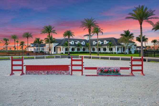 On February 5th, this 15-acre equestrian estate in Wellington Preserve will be sold at Luxury AUCTION WITHOUT RESERVE! List price is for REFERENCE ONLY. Offered in cooperation with Platinum Luxury Auctions. Inquire for details.
Listed significantly BELOW 2021 Appraisal!!! Gorgeous dream Equestrian Estate includes, 24 Stalls, approx 15 Acres (7 additional contiguous acres also available), 6 Bedroom House, All Weather Ring, Grass Jump Field, Walker, Rider's Lounge, and so much more. See Renderings for Estate Plans included in Sale. Perfect for hunter/jumpers, dressage or polo. Plenty of room for a covered arena or stick and ball field if so desired on the to be developed 6+ acres Can also subdivide into two lots. All plans available upon request Motivated Seller!!!