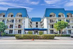 Rare FIRST FLOOR unit just steps away from the beach! You can walk to restaurants and stores.  Bright and open concept floorplan with IMPACT WINDOWS! Spacious bedrooms and a huge private balcony/patio which goes the length of the entire apartment. Ideal for people watching, and enjoying those cool ocean breezes. Pool and Fitness center.  Garage parking. 40 year and concrete restoration complete, budget has reserves.  This building works great for snowbirds and full year round residents. Rentals are allowed with restrictions.