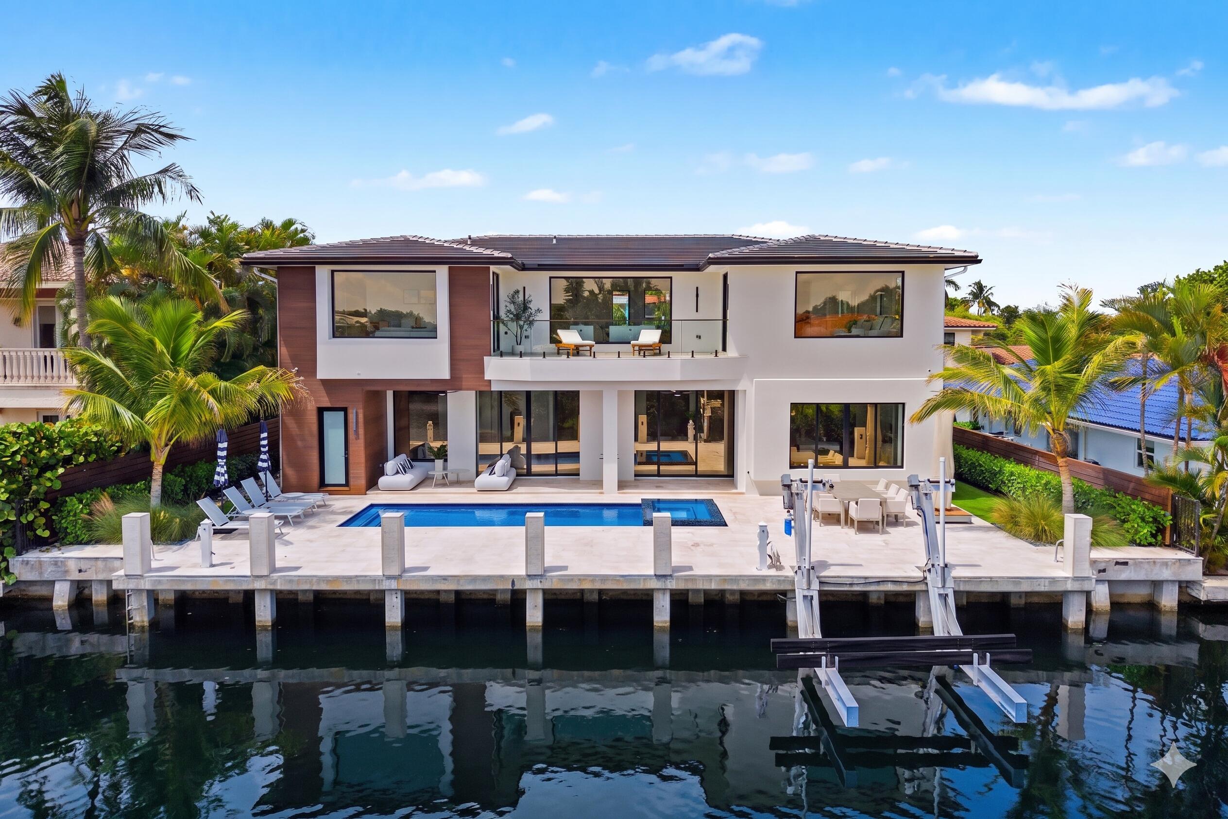 Completed in 2025, this Luxurious Deepwater Estate showcases 84' of Waterfrontage, coveted Southern Exposure and is designed for the Discerning Boater featuring a Private Dock w/ 20,000-lb Lift, Direct Ocean Access & No Fixed Bridges. Offering nearly 5,000 sq/ft of Meticulously Designed Living Space, the Residence includes 5 Ensuite Bedrooms, Office, Designer Finishes, integrated Smart-Home Technology, plus a 3-Car Garage!  The Primary Bedroom Suite is conceived as a private Wellness Retreat, featuring an exquisite Spa-Inspired Custom Sauna & Steam Room, oversized Walk-In Shower & Freestanding Soaking Tub. Layered w/ Rich Materials, Ambient Lighting and a Calming Sophistication, 798 Havana Drive delivers an unparalleled Lifestyle reminiscent of a 5-Star Waterfront Resort.