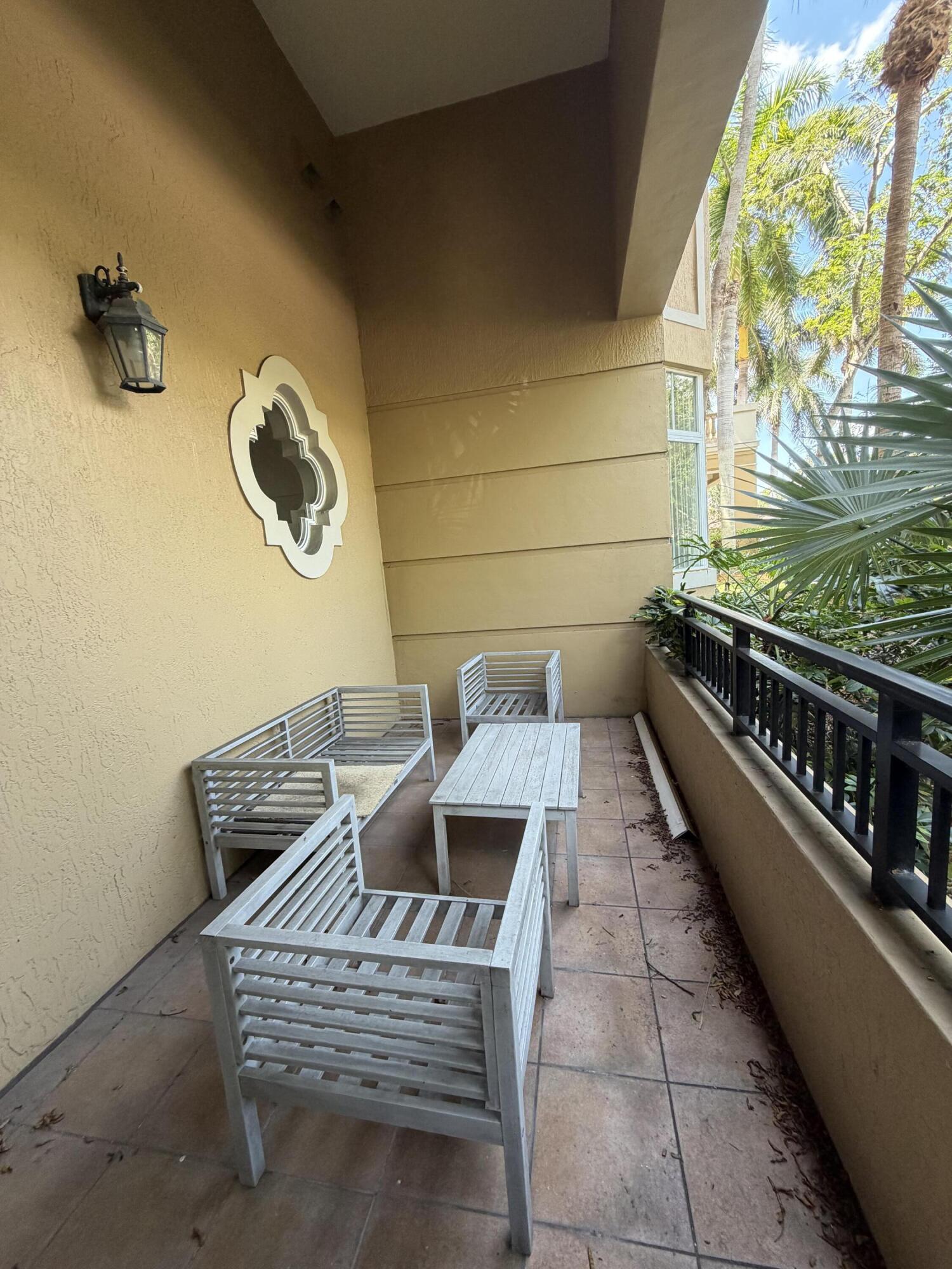 Welcome to resort-style living at The Palms at Weston — one of Weston's most desirable 55+ communities. This spacious 1-bedroom, 1.5-bath corner unit is located on the first floor of the main building and features soaring high ceilings that create an open and airy feel throughout. Enjoy the convenience and comfort of two private balconies, perfect for morning coffee, relaxing evenings, or entertaining guests. The thoughtfully designed layout offers abundant natural light, generous living spaces, and the ease of first-floor access. Residents enjoy a vibrant resort-style lifestyle with outstanding amenities including a beautifully maintained clubhouse, sparkling pool and spa, fitness center, social activities, walking paths, library, game rooms, and more. living in the heart of Weston.
