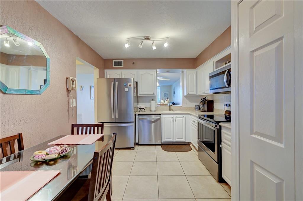 There is no place like home! Own this 2/2 ALL AGES GEM for as little as 3% down! Great Financials! 40-year inspection passed. This beauty has been updated with newer kitchen with SS appliances, Updated bathrooms, walk-in closet in the primary, 5yr Tankless water heater, 3 yr. New AC, ALL IMPACT WINDOWS, Tile through-out, balcony (to sip your morning coffee), lots of storage closets & Let's Not forget there is a WASHER/DRYER In the unit for your convenience. These amenities are Bar None: heated pool, hot tub, BBQ area, tot lot, exercise room, library, clubhouse, sauna, Theater, Shuffleboard, additional storage on the floor, and so much more. Conveniently located to Promenade for dining and shopping. You won't regret this showing. Perfect for First time home buyers!