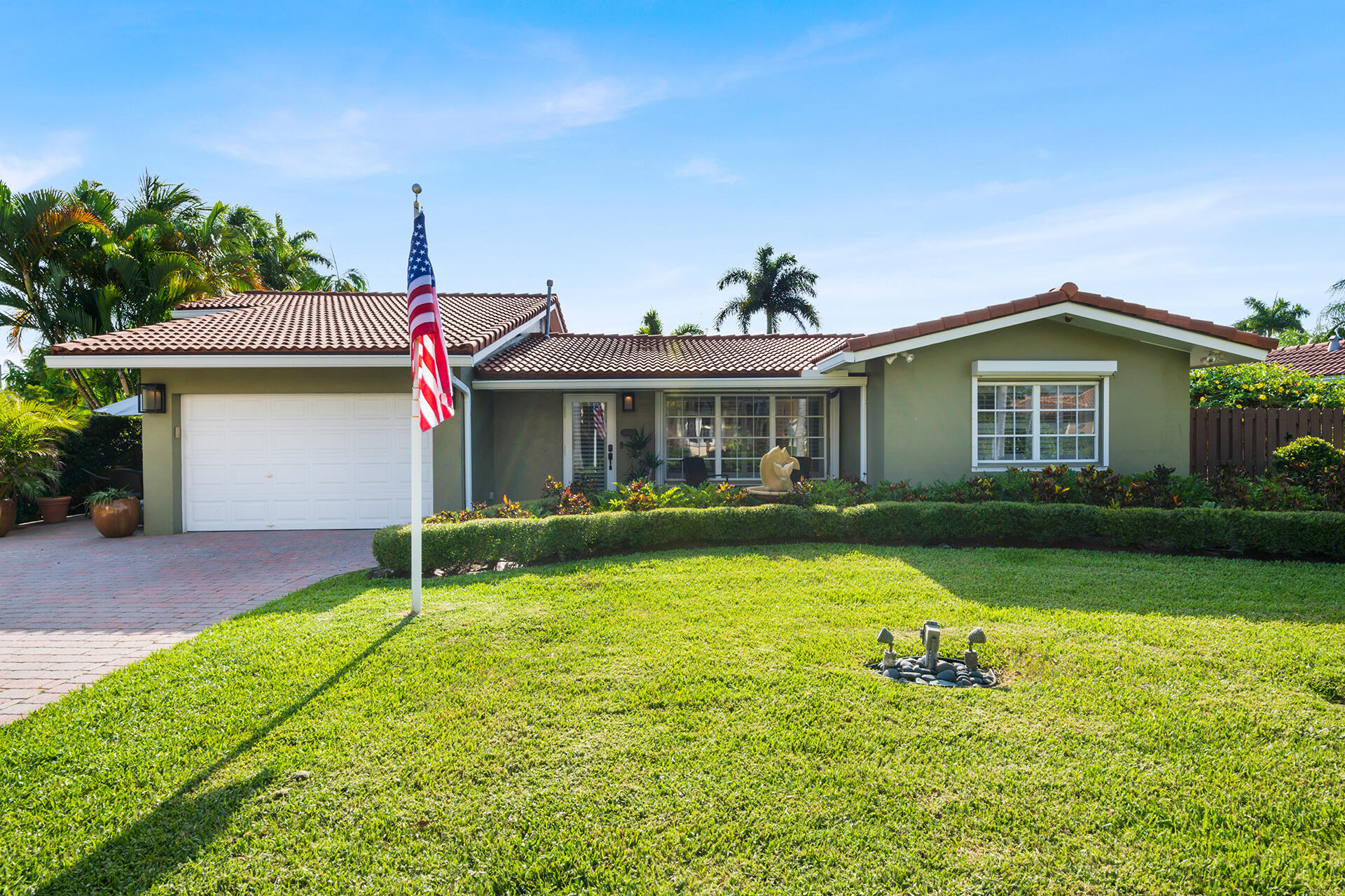 Welcome to 1755 E Terra Mar Drive, a beautifully maintained coastal residence located in the prestigious beachside community of Terra Mar Island Estates. Situated on a spacious corner lot steps from the neighborhood's deeded private beach access, this exceptional property offers the perfect combination of comfort, functionality, and the relaxed South Florida lifestyle.  This 3-bedroom, 2-bathroom home with a versatile den features a thoughtfully designed floor plan with multiple living and entertaining spaces. Interior highlights include 24-inch porcelain tile flooring, plantation shutters, custom cabinetry, a built-in bar with wine cooler, surround sound system, and a gas range for those who enjoy cooking and entertaining.  One of the bathrooms has been recently renovated, adding a fresh and modern touch to the home's coastal character.  The outdoor living experience is equally impressive. Step into your own private tropical retreat featuring lush mature landscaping, a heated saltwater pool and spa with jets, a spacious paver patio, and a turf putting green perfect for relaxing or entertaining guests year-round. The corner lot location enhances privacy while providing attractive curb appeal and additional outdoor space.  The home is well-equipped for peace of mind and convenience with impact-rated doors, an impact garage door, accordion hurricane shutters, central air conditioning, and a partial-house generator backup system. The one-car garage includes premium built-in storage solutions and additional storage closets, offering excellent functionality rarely found in beachside homes.  Terra Mar Island Estates is one of Pompano Beach's most desirable waterfront and beachside neighborhoods, known for its upscale homes, quiet streets, and private beach access. Residents enjoy a voluntary, low-cost homeowners association and a true neighborhood feel while remaining close to dining, shopping, golf courses, marinas, waterfront restaurants, and all the amenities that make Pompano Beach a premier coastal destination.  Furniture is negotiable, making this an excellent opportunity for a primary residence, seasonal retreat, second home, or investment property. With deeded private beach rights included and an unbeatable location just moments from the sand and ocean, this property presents a rare opportunity to own in one of South Florida's most coveted beachside communities.