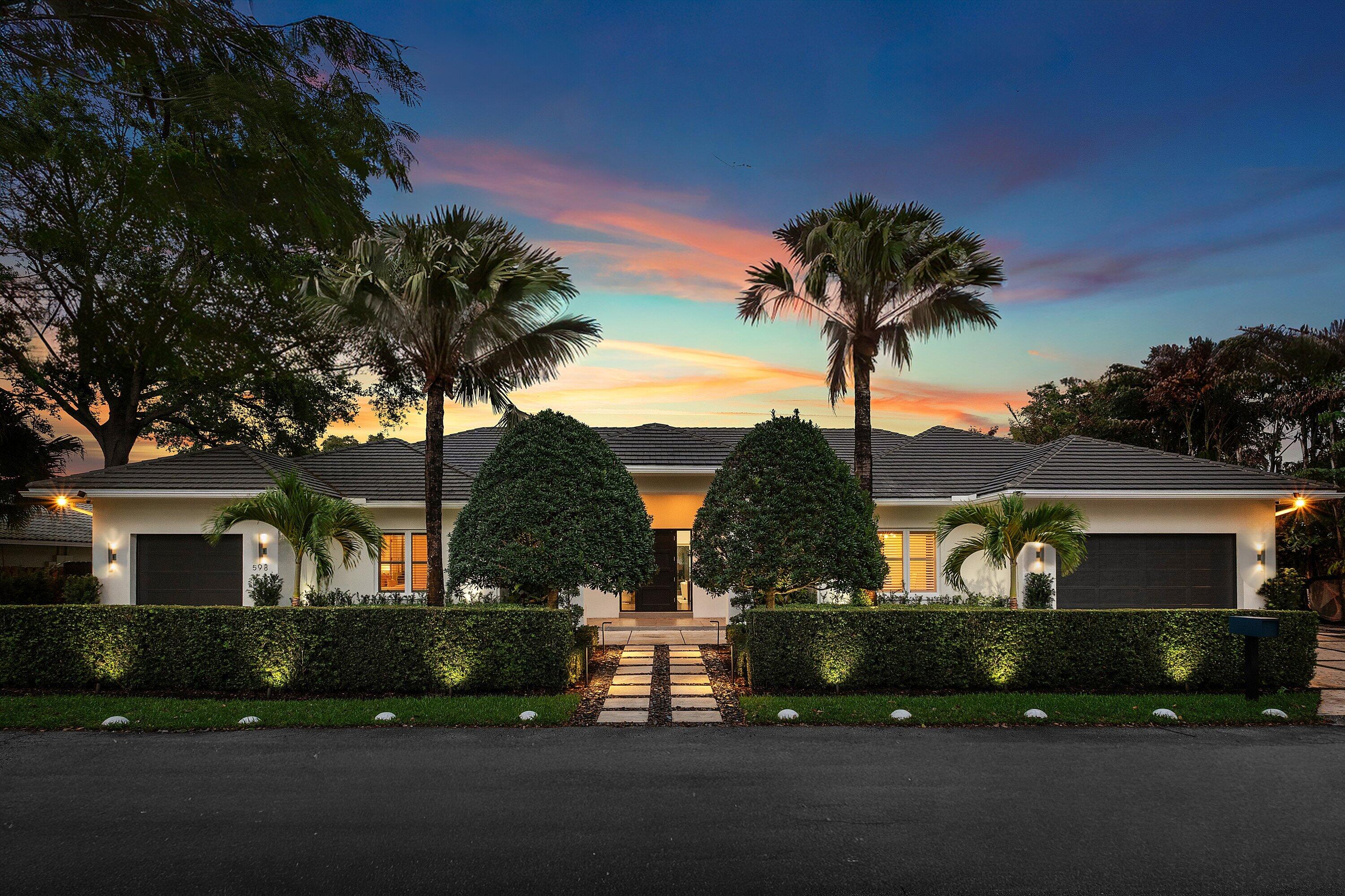 Experience refined single-story living in one of East Boca Raton's most coveted and rarely available enclaves, adjacent to Old Floresta.  This exceptional ranch-style estate masterfully blends architectural sophistication with effortless livability—offering a seamless floorplan ideal for families and those who value both comfort and elegance. Spanning a thoughtfully designed layout, the residence features five spacious en-suite bedrooms and a refined powder bath, creating the perfect balance of privacy and functionality. The single-level design enhances everyday living, providing ease, flow, and a true sense of home.  At the heart of the residence, a beautifully appointed chef's kitchen showcases a new dual-fuel gas cooktop, premium appliances, and an open-concept design that flows seamlessly into the grand great room—complete with an electric fireplace and built-in bar with wine chiller—ideal for both intimate gatherings and elevated entertaining. Designed with today's lifestyle in mind, the home also includes a dedicated office or den, while a privately situated fifth bedroom with its own entrance and garage is perfect for guests, in-laws, or live-in staff. Outdoors, a resort-style setting awaits with a heated and cooled pool, covered patio, and a thoughtfully designed entertaining station featuring a sink, undercounter refrigerator, and generous serving counter—perfect for effortless indoor-outdoor living and hosting. Additional features include impact glass throughout, natural gas, a full-house generator, an Aqualite reverse osmosis (R/O) water filtration system, spacious laundry room, and comprehensive security system. A split three-car garage completes the offering. Perfectly positioned just minutes from Mizner Park, The Boca Raton, pristine beaches, and within close proximity to the area's top-rated public and private schools, fine dining, and luxury shopping—this is a rare opportunity to own a move-in ready, single-story estate in a highly sought-after East Boca location. LUXURY. LIFESTYLE. LOCATION.
