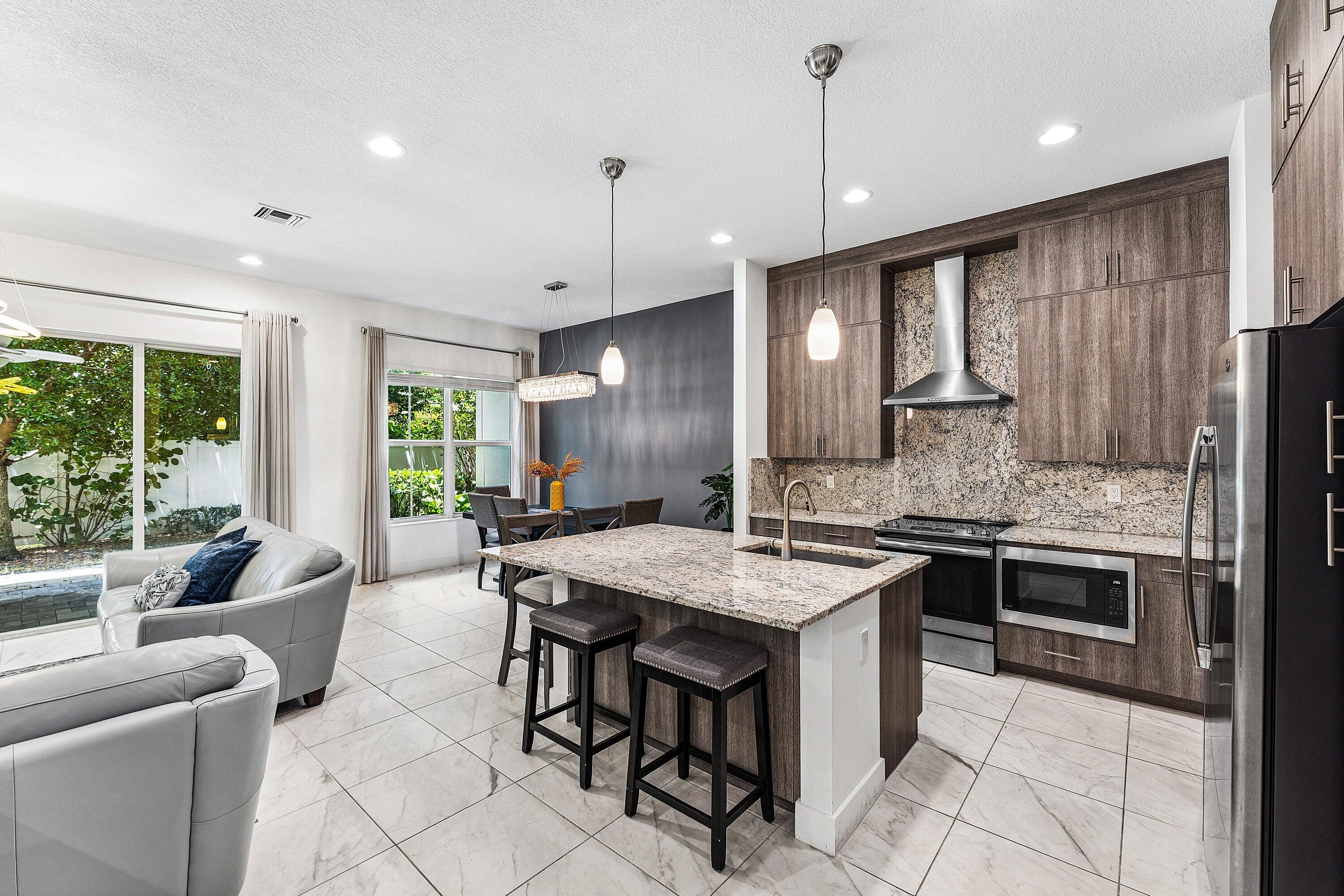 Beautiful 3 bedroom + loft/2.5BA townhome in the heart of Palm Beach Gardens. High ceilings, tile flooring. Large granite kitchen w abundant counter space & storage. Upstairs primary suite has large walk-in closet w custom built-ins, loft for 2nd living space. large upstairs laundry room has sink & tons of upper cabinetry for storage. Furniture negotiable. Finished 2 car garage has 2nd refrigerator. Covered paver patio with privacy fence. Steps to Fresh Market & restaurants. 4 pets allowed (2 cats & 2 dogs up to 90lb/non-aggressive breed). Close to I95, PGA National, shopping & fine dining.