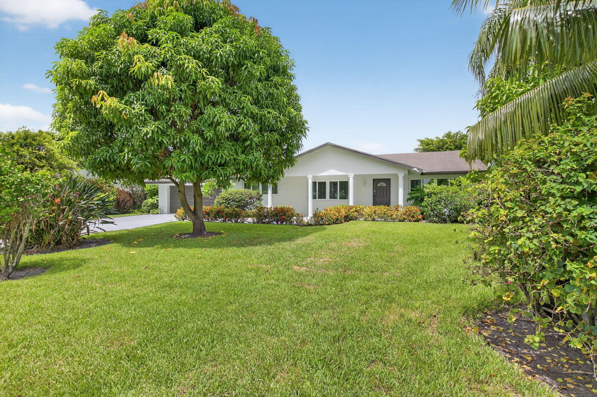 Gorgeous single family pool home in Delray Beach. Home features 4 spacious bedrooms + flex/bonus room, 2,200+ square feet under air, fully upgraded, brand new two-tone kitchen with custom cabinetry, new appliances, wine cooler and beautiful Quartz countertops. Newer bathrooms, custom LED lighting all throughout the home, spacious walk-in closet in master bedroom w/ custom powder room. This home offers the perfect blend of luxury, convenience and privacy. 2 car garage plus oversized driveway, hurricane impact windows, screened in pool patio and large backyard (over 10,000 sqft LOT) with fruit trees and a garden oasis for privacy. Ideal for entertainment and summer vibes all year round! Salt water pool system, no HOA, split floor plan, abundance of natural light, sprinkler system and more! Conveniently located within 3 miles off Atlantic Avenue, nearby local shops, fine dinning, grocery stores, close distance to major highways, schools, houses of worship and 4 miles to the beach. Call today to book your private tour.