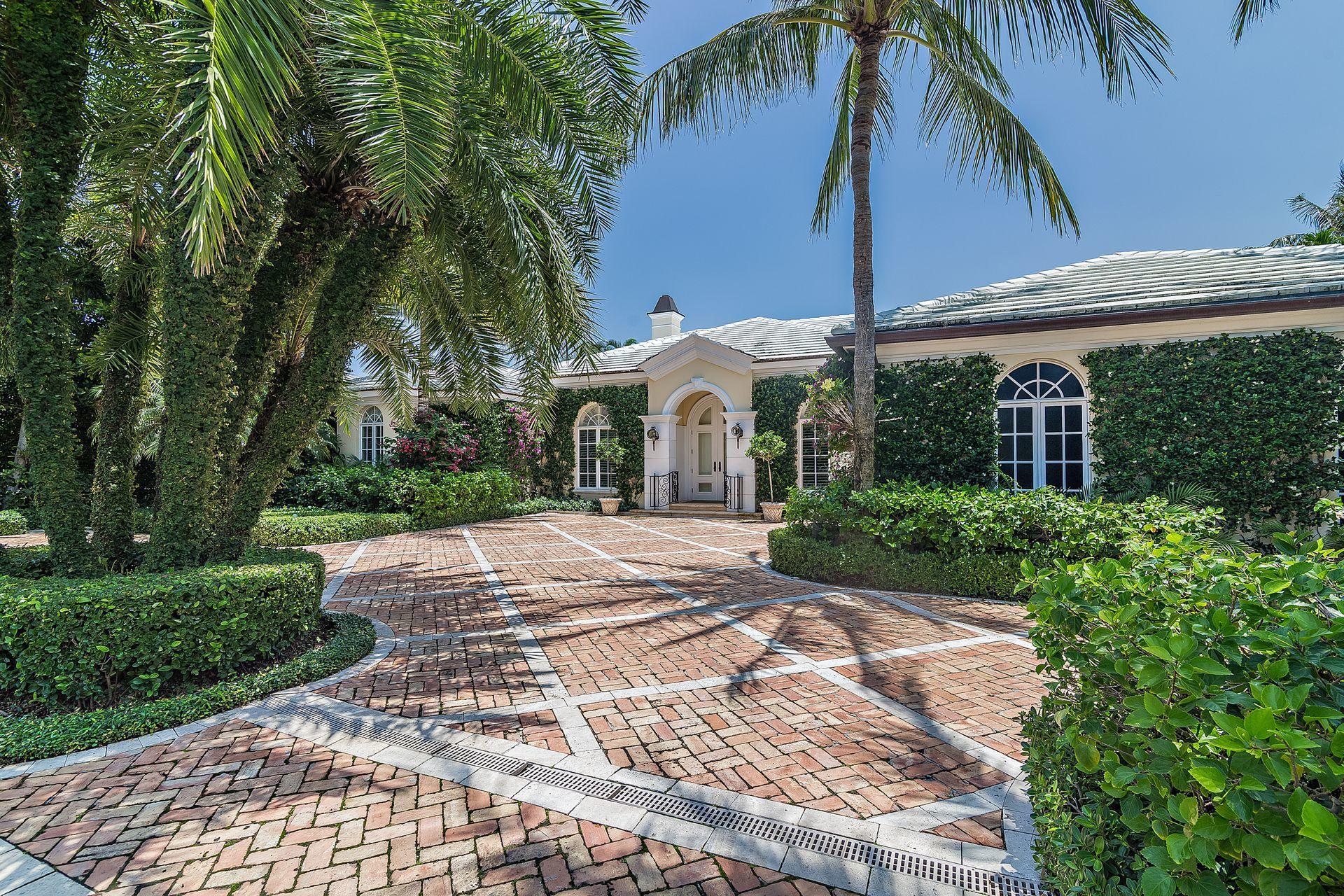 Welcome to 232 Sandpiper Road. Sandpiper Road is a premium north end street with deeded beach as well as easy lake trail access. As you drive up to this Chicago brick motor court surrounded by beautiful grounds, two double doors greet you to this elegant single-story Bermuda residence. Built in 2002, well maintained with many improvements, this home offers a gracious and flexible floorplan, rooms beautifully appointed, 12' ceilings throughout, gas operated fireplaces, hard wood floors, as well as many other quality finishes. Private and serene, French doors open onto the loggia and pool area, offering the best of indoor and outdoor entertainment.