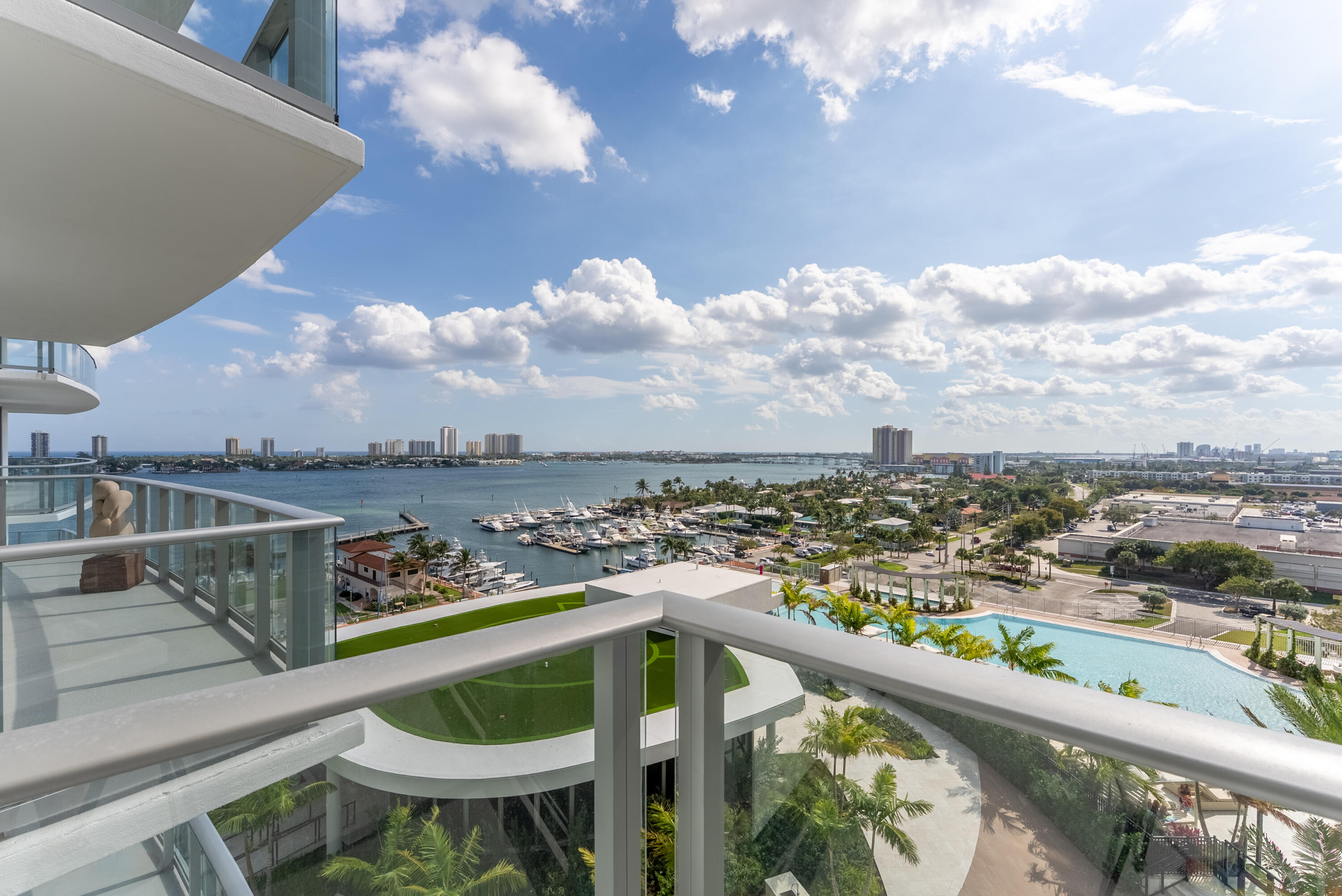 Be the first to enjoy this brand new, never lived in, waterfront residence at Nautilus 220. This 2-bedroom, 2.5-bath condo features TWO PARKING SPOTS, private storage unit, 10-foot ceilings, a bright open layout, and elevated finishes throughout, including European porcelain tile and cabinetry, quartz countertops, front-lit mirrors, dual vanities, walk-in closets, glass-enclosed showers, and a soaking tub. The chef's kitchen is equipped with Miele appliances, a beverage cooler, and a striking quartz waterfall island. Positioned on the 10th floor, the south-facing terrace offers sweeping east, west, and south views, including Peanut Island, along with ocean and Intracoastal vistas overlooking the resort-style pool deck. Nautilus 220 offers full-service, resort-style living with a 6th-floor pool deck, firepit lounges, spa, grill stations, rooftop lap pool, fitness, spin and yoga studios, sauna and steam rooms, bowling alley, theater, golf simulator, lounges, kids and teen rooms, beach access on Singer Island, EV charging, concierge services, and waterfront dining by Celebrity Chef David Burke.