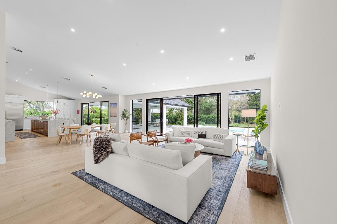 This completely renovated single-family home is perfectly situated on a beautifully mature, landscaped one-acre lot in the Aero Club with private air strip. Offering privacy, space, and modern luxury. Designed for effortless living and entertaining, the home features a brand-new chef's kitchen with ample storage and stunning finishes, while all four bedrooms include their own en-suite bathrooms for ultimate comfort and privacy. Vaulted ceilings and an abundance of natural light enhance the open, airy feel throughout, and a massive covered outdoor living area creates a seamless indoor-outdoor flow ideal for entertaining, overlooking a sparkling pool. Completing the property is a spacious three-car garage, making this exceptional home as functional as it is elegant.