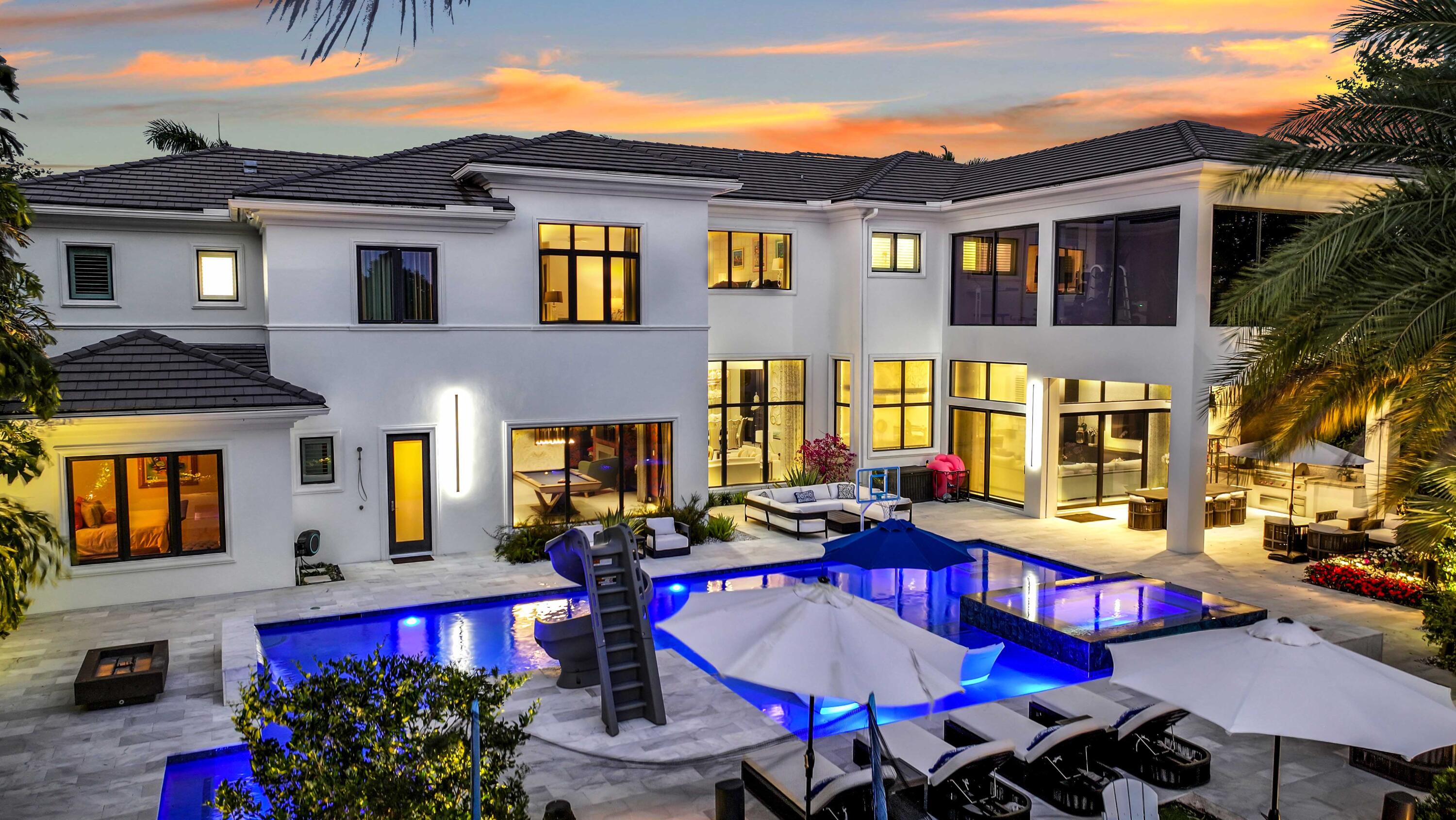 Rare opportunity to own a luxury custom estate with full golf equity membership available in prestigious Mizner Country Club. This exceptional property offers 6 bedrooms, plus two offices/club rooms and a home theatre. Marble floors, soaring ceilings, a chef's kitchen, elevator, and Lutron & Savant smart home systems. Enjoy a completely rebuilt custom theatre whole-house HEPA air filtration, and a 2nd floor gym overlooking the golf course from the primary suite for breathtaking views while you exercise.

Designed for both relaxation and recreation, the estate features two elegant club rooms—one on each level—ideal for entertaining, lounging, or creating additional versatile living spaces.

Outdoors, indulge in a resort-style backyard featuring a covered lanai with outdoor kitchen.