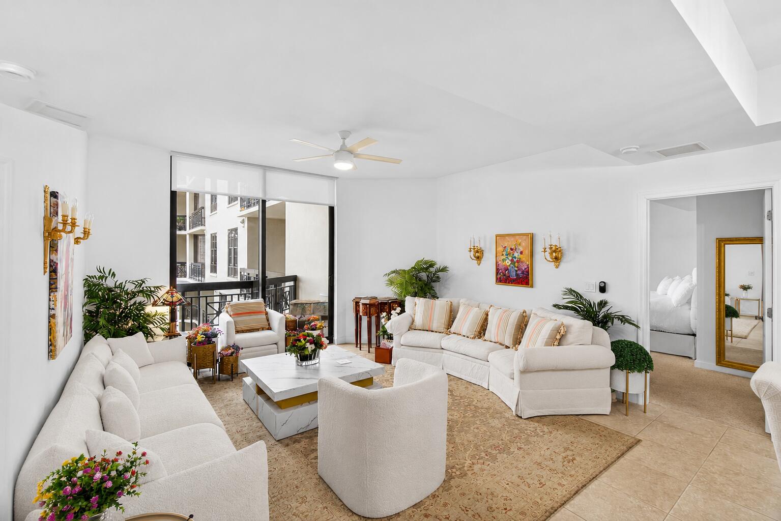Experience sophisticated downtown living in this beautifully appointed 2-bedroom, 2-bath residence at One City Plaza, perfectly positioned in the heart of vibrant Downtown West Palm Beach. This spacious home features an exceptional dual-access balcony, seamlessly connecting the living area and primary suite while overlooking the picturesque courtyard, tranquil water fountains, and breathtaking sunset city views. The thoughtfully designed floor plan includes a generous primary suite with additional flex space, ideal for a private home office or sitting area. High ceilings, updated designer lighting, and remote-controlled custom window screens and blinds add both style and convenience throughout. Offered furnished, partially furnished, or unfurnished to accommodate your lifestyle, this  residence is move-in ready and includes one assigned garage parking space. Enjoy the best of downtown living just moments from world-class dining, shopping, entertainment, the waterfront, Palm Beach Island, and the Brightline station. One City Plaza offers luxury full service amenities that include; 24-hour front desk service, manned gated garage, complimentary valet, rooftop pool with panoramic city & ocean views, summer kitchen with grills, sauna and steam rooms, fitness center, club room, and more.