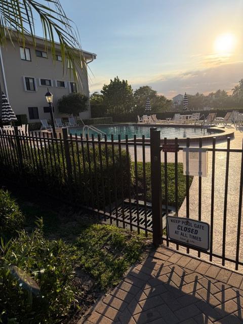Newly painted 2 bedroom / 2 bathroom Corner end-unit with views of Southgate's infamous Lazy River, Tropical Garden and the Fountain (shaded balcony inmost popular C building). The unit comes with large 24'' tile flooring throughout, a fully screened in balcony, and a  custom screen door Impact windows and door, lots of storage space. There is a private access point to the beach (with beach equipment storage locker). The assigned parking spot is right in front the unit.  Southgate has passed the 50-yr recert., and has reserve funding is in place! Owner financing available!