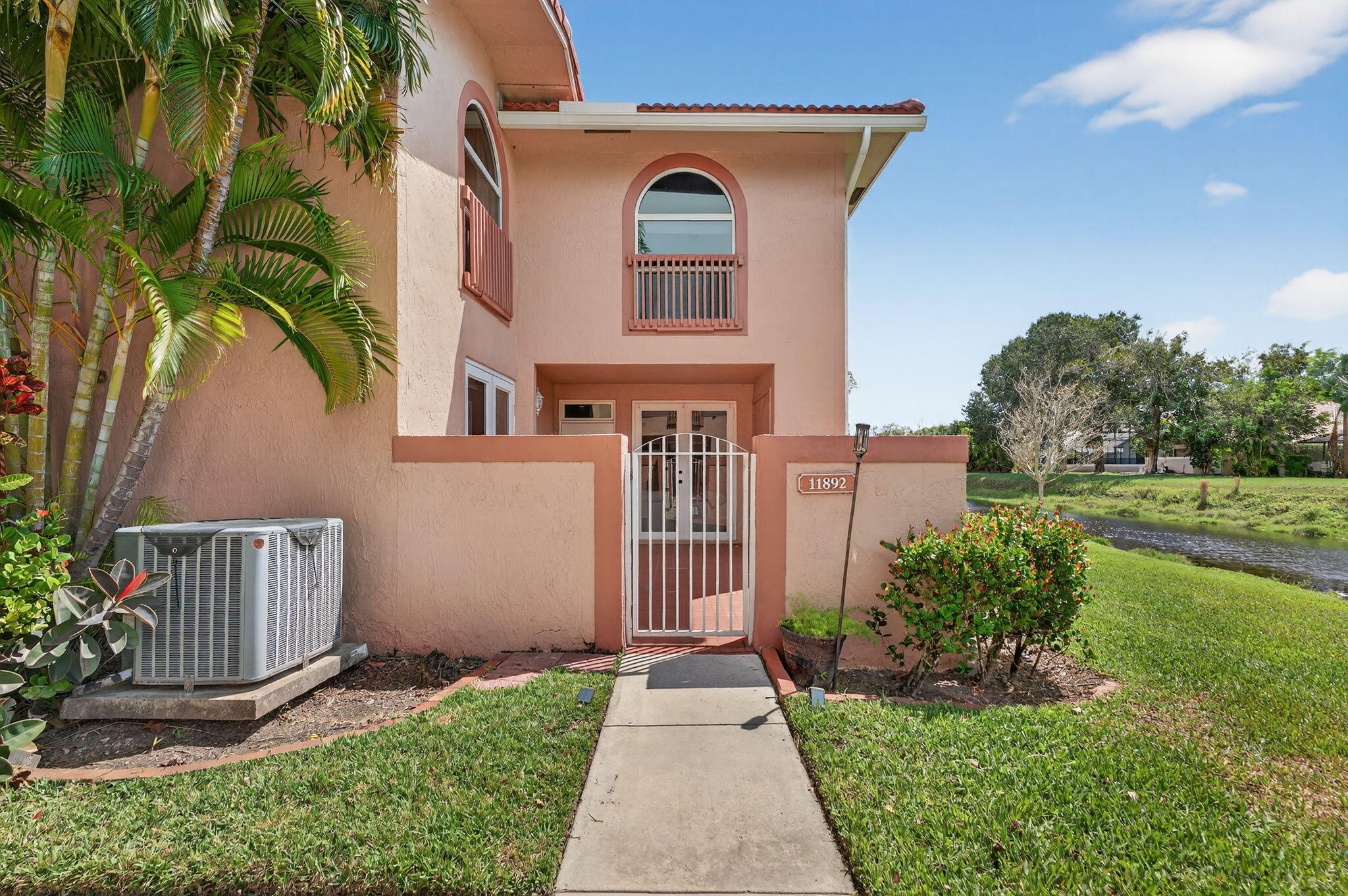 Remodeled Corner Unit with a Canal View and a Private Courtyard Patio. 3 Bedroom / 2.5 Bath with an Open Floor Plan. Large Living Area - Breakfast Bar - Kitchen Boasts Granite Counters and SS Appliances - French Doors out to Patio. All Bedrooms are Upstairs - 1/2 Bath Downstairs - Spacious Primary Bedroom with Plenty of Storage. IMPACT WINDOWS - ROOF 2024 - Extra Storage Closet on the Patio - Community Pool - 2 Assigned Parking Spaces. No Leasing Permitted - All Ages - Pets Welcome - Low Monthly HOA