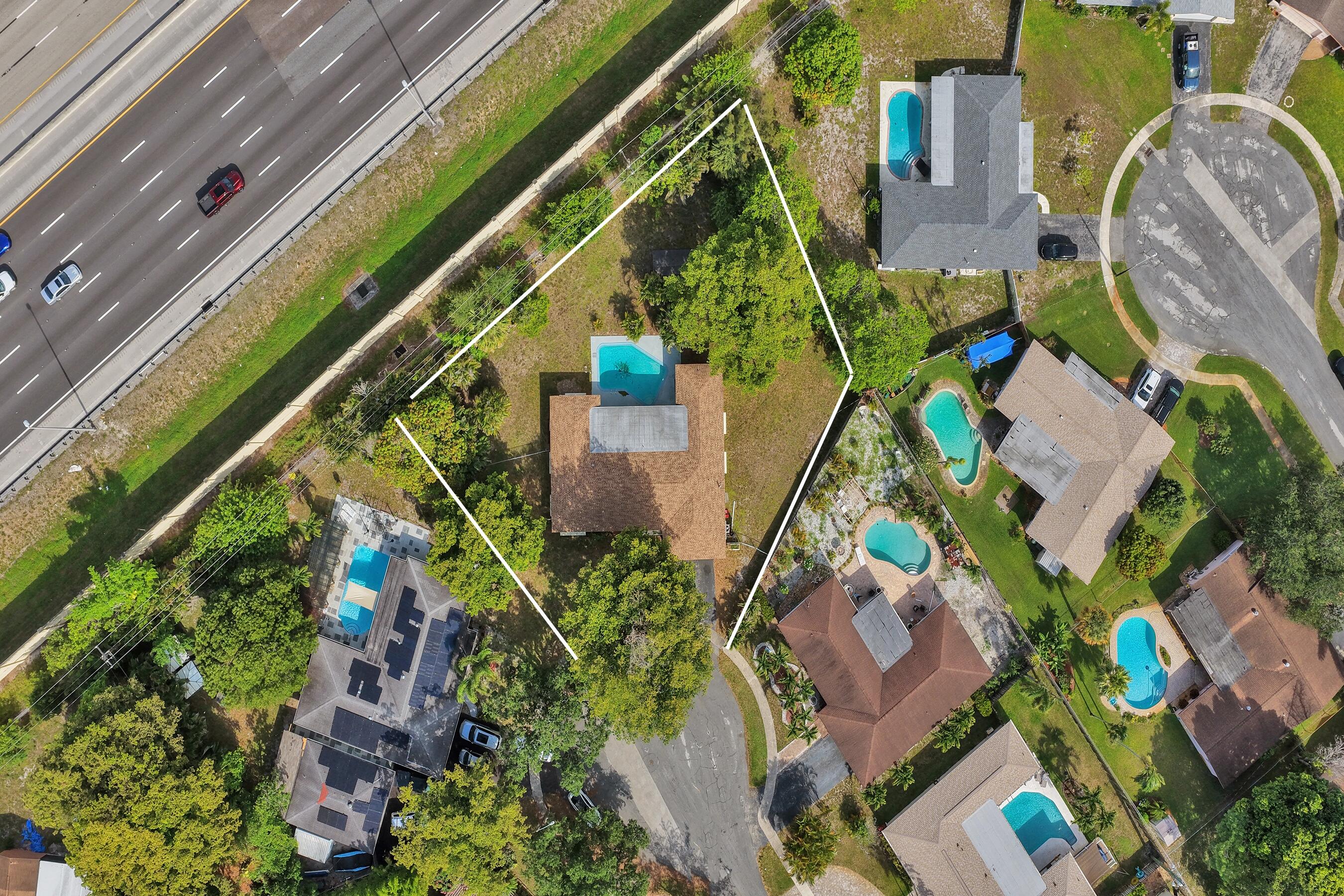 NO HOA! Tucked away at the end of a quiet cul-de-sac, this spacious 4+den/5th bedroom, 2bath pool home sits on oversized .41-acre lot in the heart of Plantation. NEW ROOF '22 & AC '24. Offering plenty of space in & outside this home is the perfect opportunity for buyers looking to create their Florida paradise. The flexible floor plan provides room for everyone, w/a den that can easily serve as a 5th bedroom, home office, playroom, or hobby space. Outside, enjoy a private backyard retreat featuring a pool & abundant space for entertaining, gardening, pets. Conveniently located near parks, schools, shopping, dining and major roadways. While the home does need updating & cosmetic improvements, it offers generous living areas and incredible potential for customization at an excellent price.