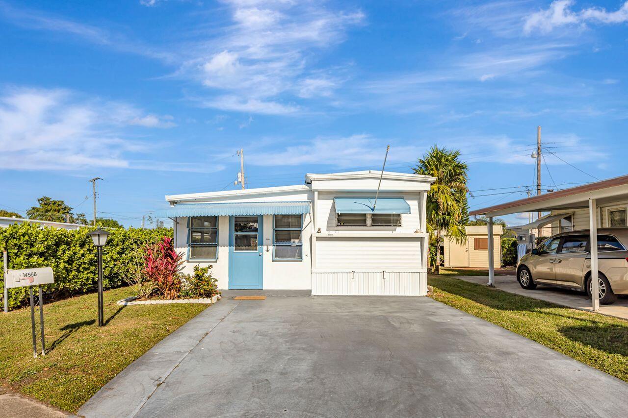 Make this charming 2-bedroom home your own and start enjoying the best of South Florida living! It has updated flooring and a newer air conditioner. It comes fully furnished with everything you need; just bring your personal touches and settle right in. Enjoy the oversized sunroom. Outside, you'll find a storage shed and patio.  You own the land - keeping association fees extremely low! This welcoming community offers a pool, shuffleboard, and clubhouse. It's a lively, social neighborhood with regular activities. Located in the heart of Delray Beach, this home offers unbeatable convenience. You're just minutes from I-95, the beach and vibrant downtown. Whether you're looking for a seasonal getaway or a full time residence, this affordable home is an incredible opportunity.