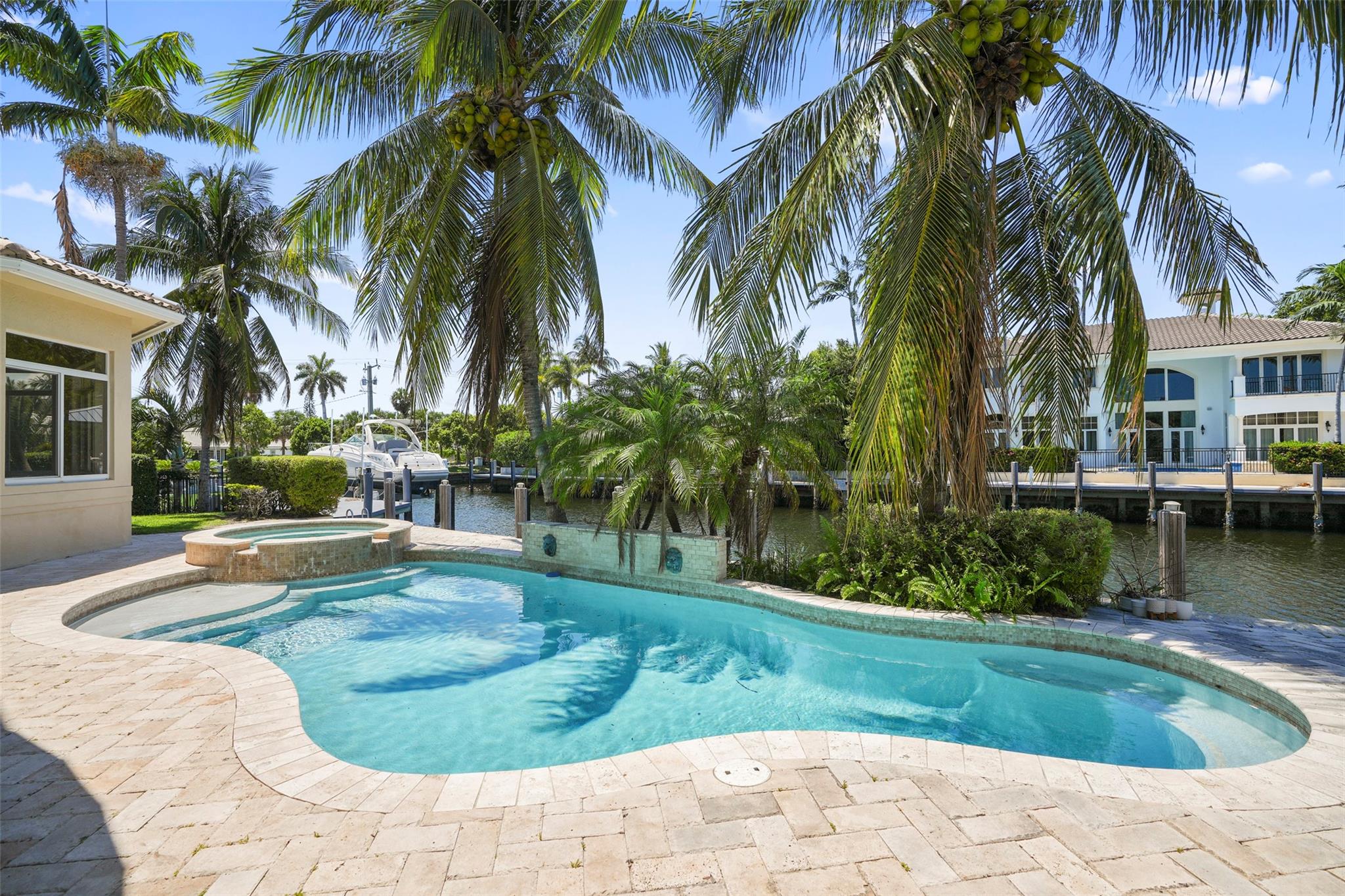 ABSOLUTELY STUNNING HOME ON 100' WIDE DEEP WATER CANAL. DRAMATIC ENTRY WITH FORMAL LIVING ROOM, DINING ROOM, GAS FIREPLACE. GOURMET KITCHEN W/EAT IN AREA & FAMILY ROOM OVERLOOKING THE WATER. BUTLER PANTRY, 2 LAUNDRY ROOMS,1ST FLOOR MASTER SUITE W/SITTING AREA & MORNING BAR. UPSTAIRS OFFERS 4 ADDITIONAL BEDROOMS, A LARGE COVERED TERRACE WITH A WATER VIEW & LOFT AREA. ELEVATOR. OUTSIDE OFFERS SUMMER KITCHEN & POOL.