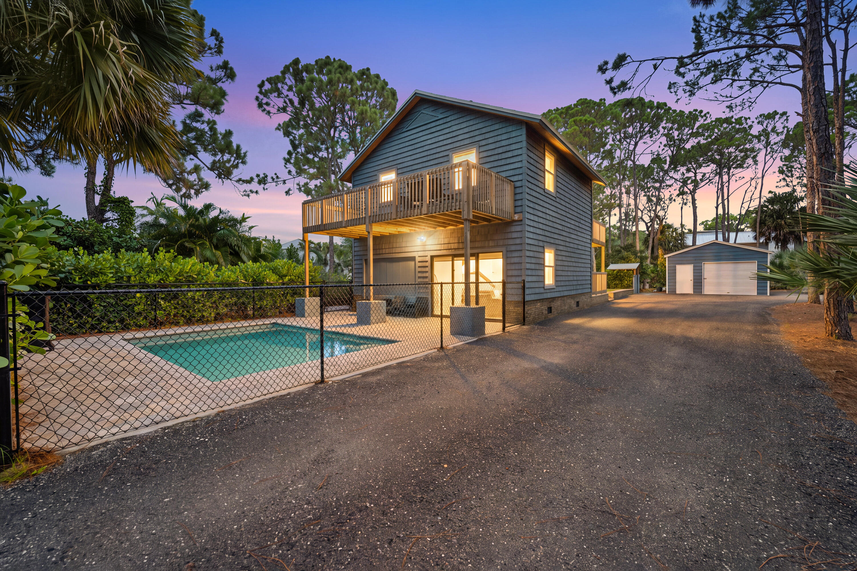 Exceptional investment opportunity in Palm Beach Gardens. Successfully operating as an Airbnb/short-term rental, this fully updated property sits on over 1 acre with no HOA and offers endless potential as an income-producing investment, primary residence, or vacation home. Unique floor plan featuring an upper level with a kitchen, living area, and flexible sleeping space, plus a lower level with a bedroom, living area, and laundry. Plenty of room for boats, RVs, trailers, and recreational vehicles, plus full RV hookups. Move-in ready and conveniently located near I-95, the Florida Turnpike, shopping, dining, golf, and beaches.